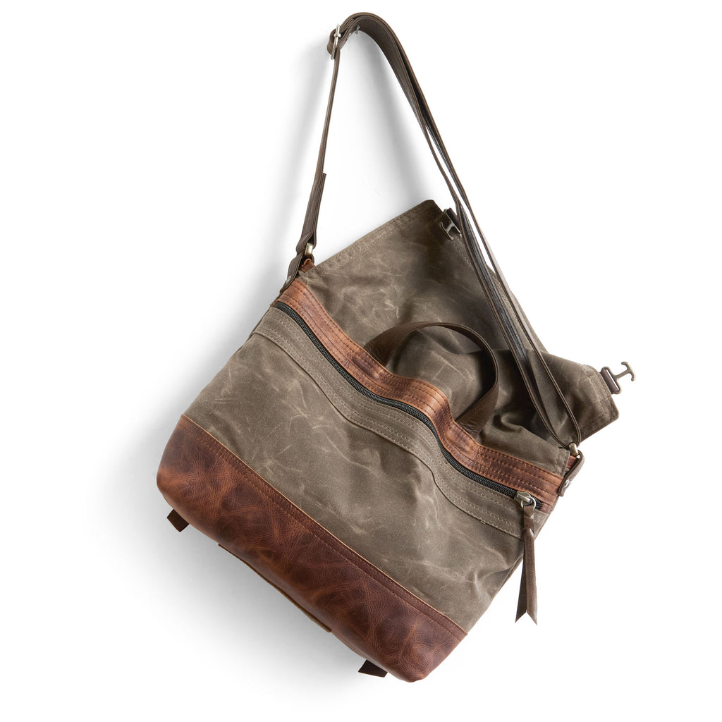 1909 medium in dark oak canvas and fuentes base showcasing back exterior zippered pocket