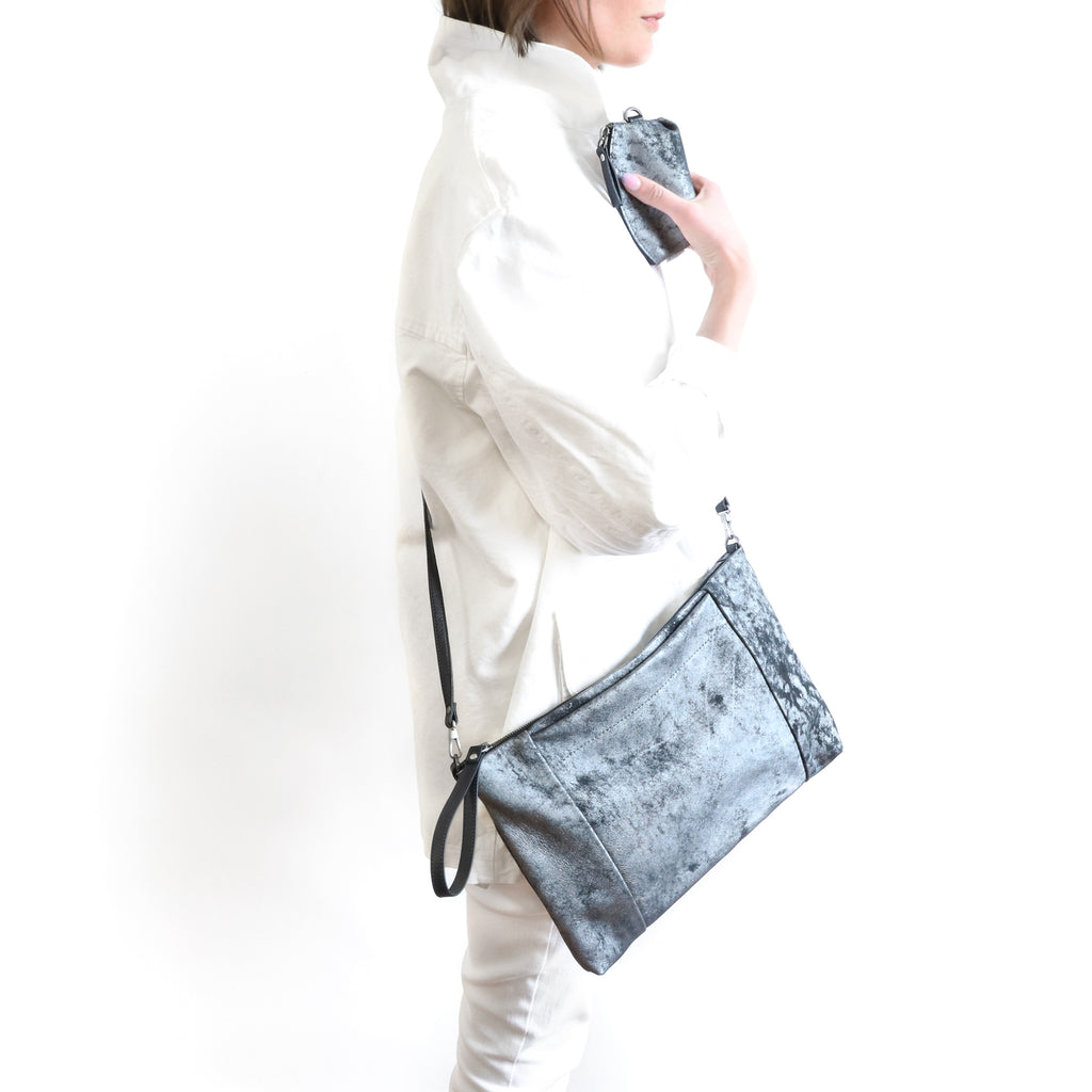 model holding a bijoux with marsden xl in brushed steel and black