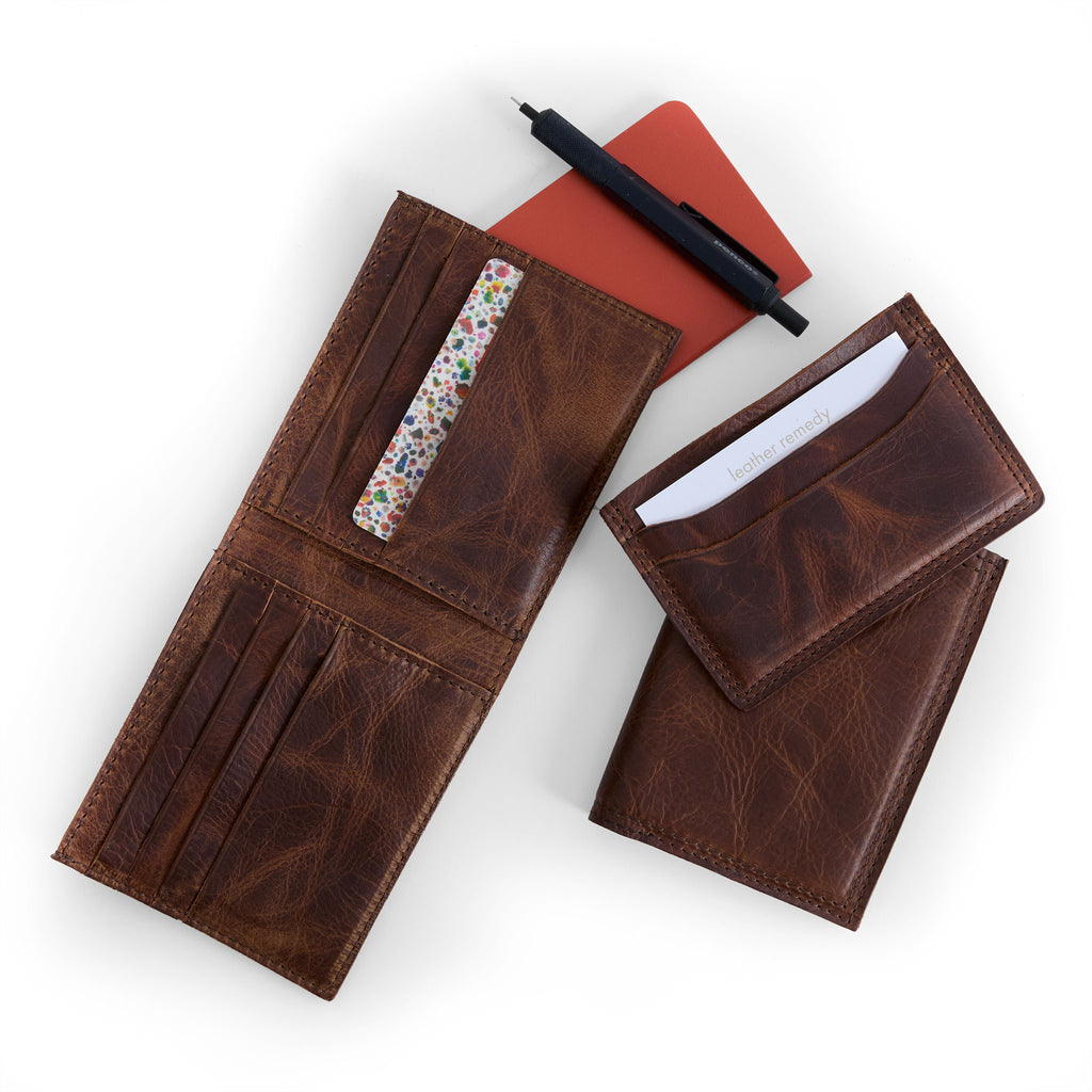 bifold wallet in fuentes next to five slot wallet