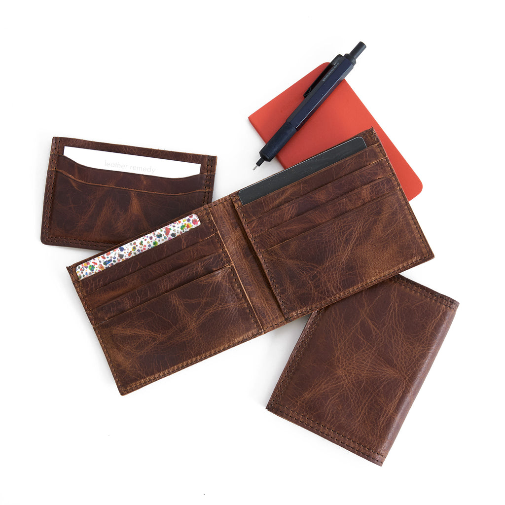bifold wallet in fuentes, beside a five slot wallet