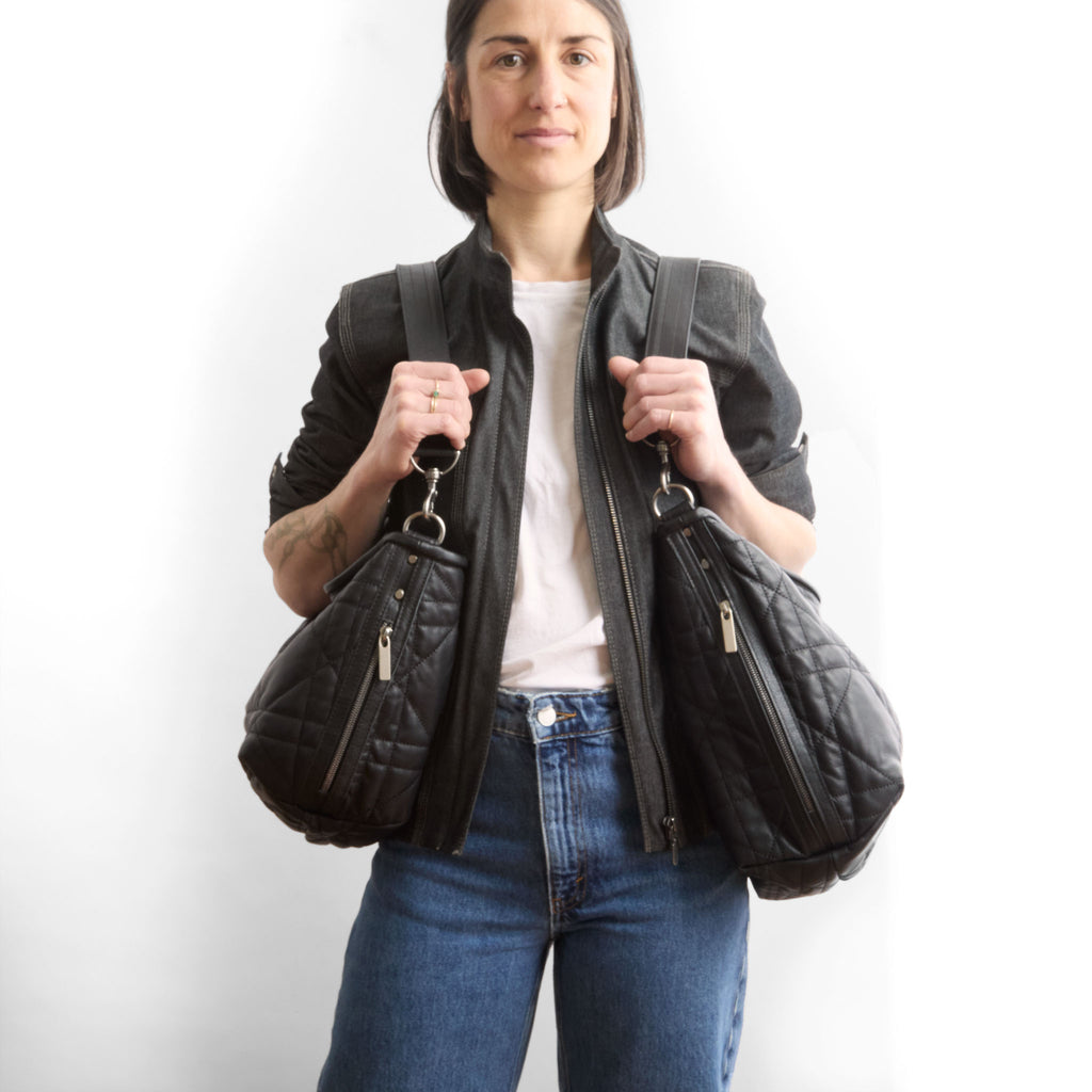 model wearing a quilted pashi black boho e+w dz size large on right and medium on left