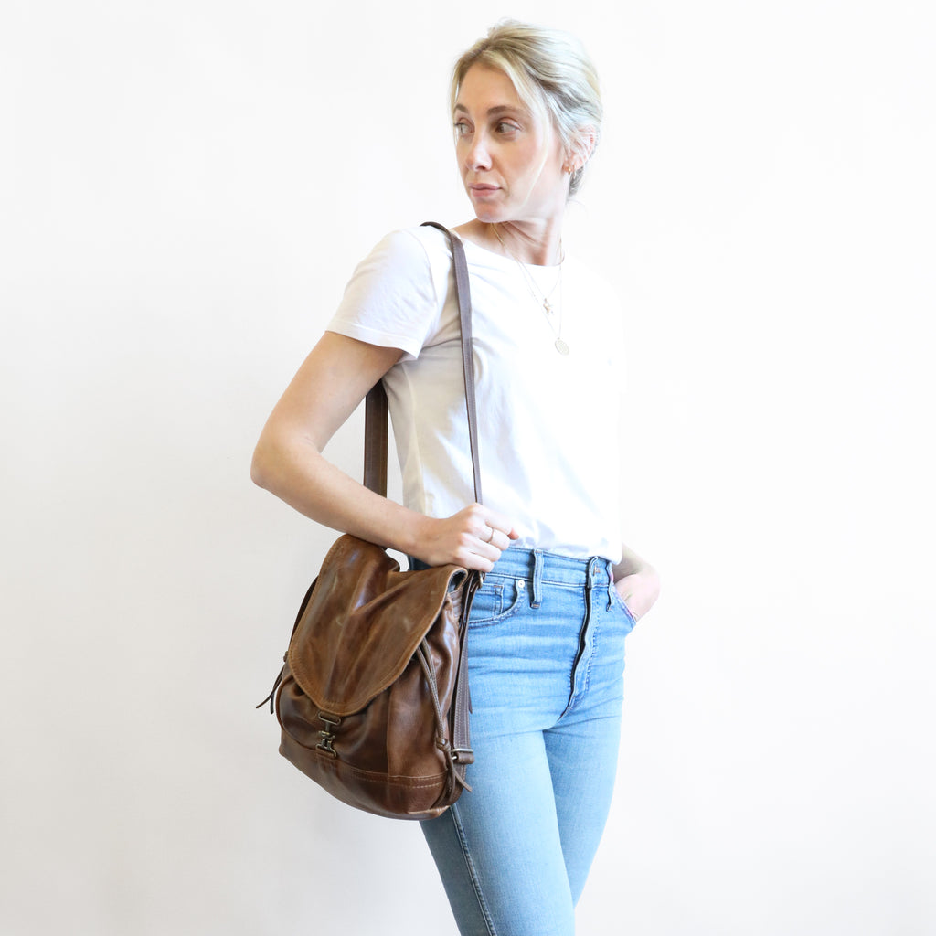 Side-front view of model carrying a 1904 maxwell, size small, on shoulder.