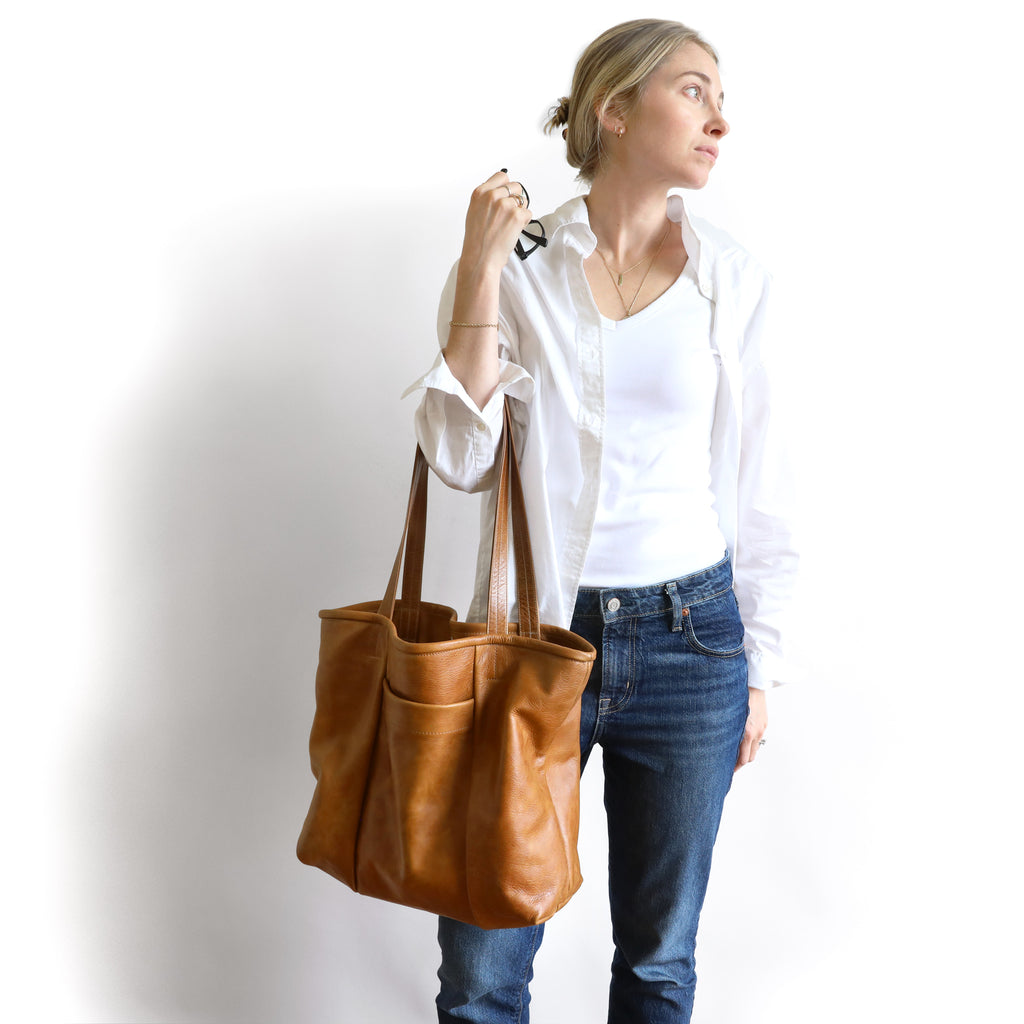 model holding asher large in basque saddle