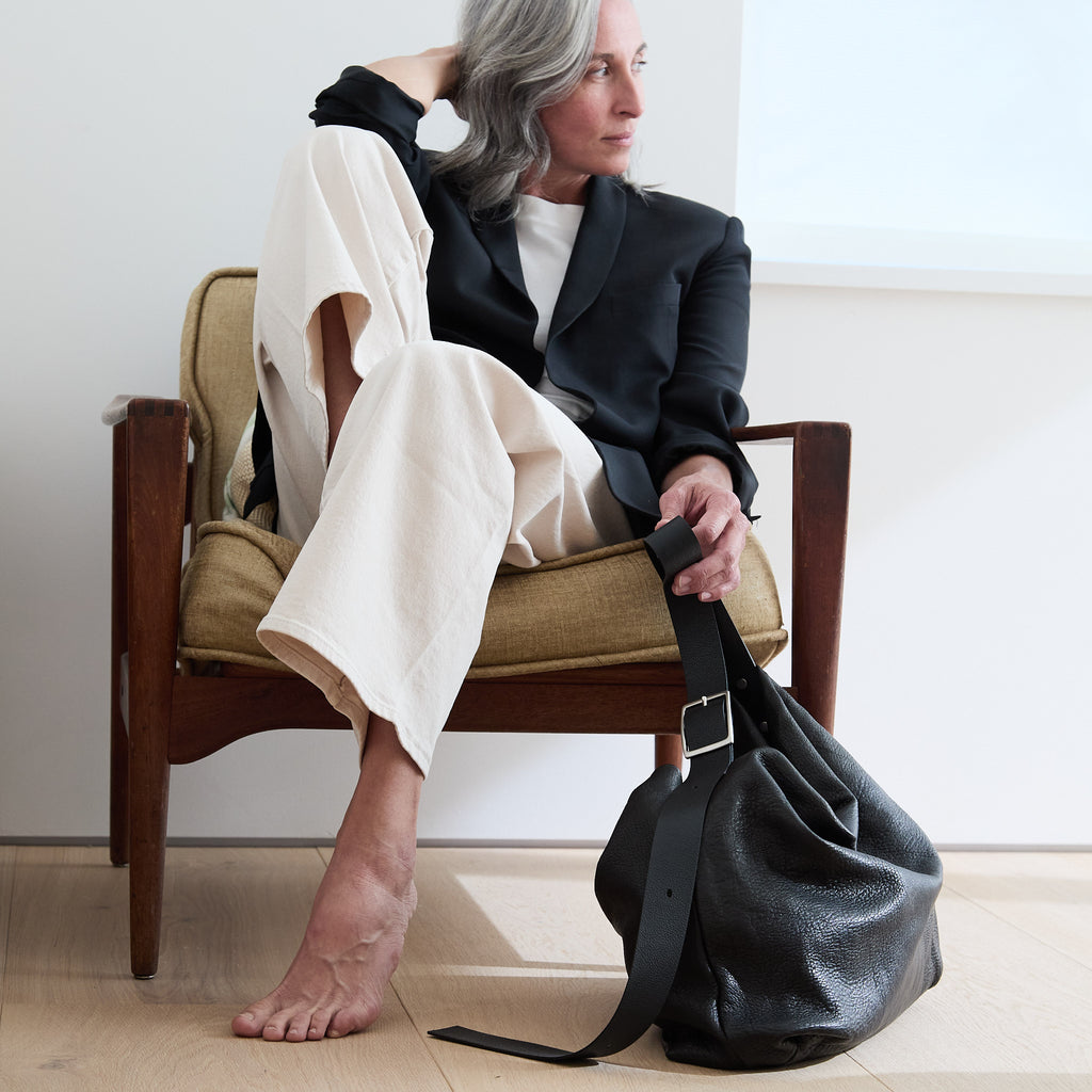 model sitting beside a central boho 