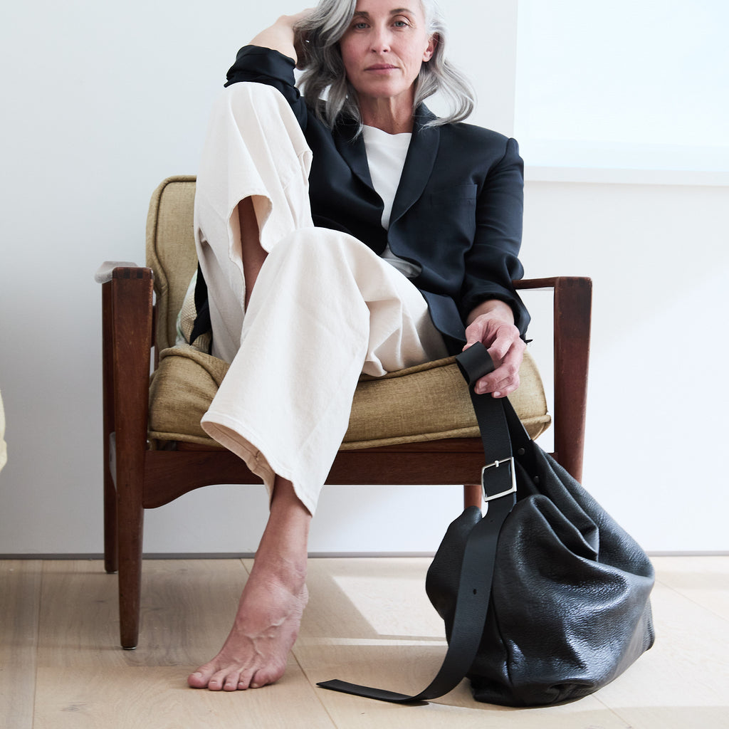 model sitting beside a central boho 