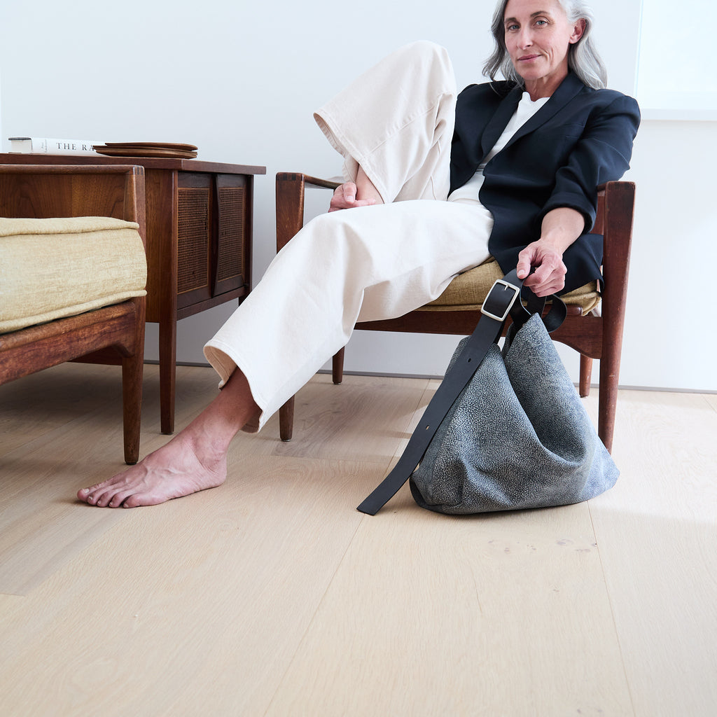 model sitting beside a central boho 