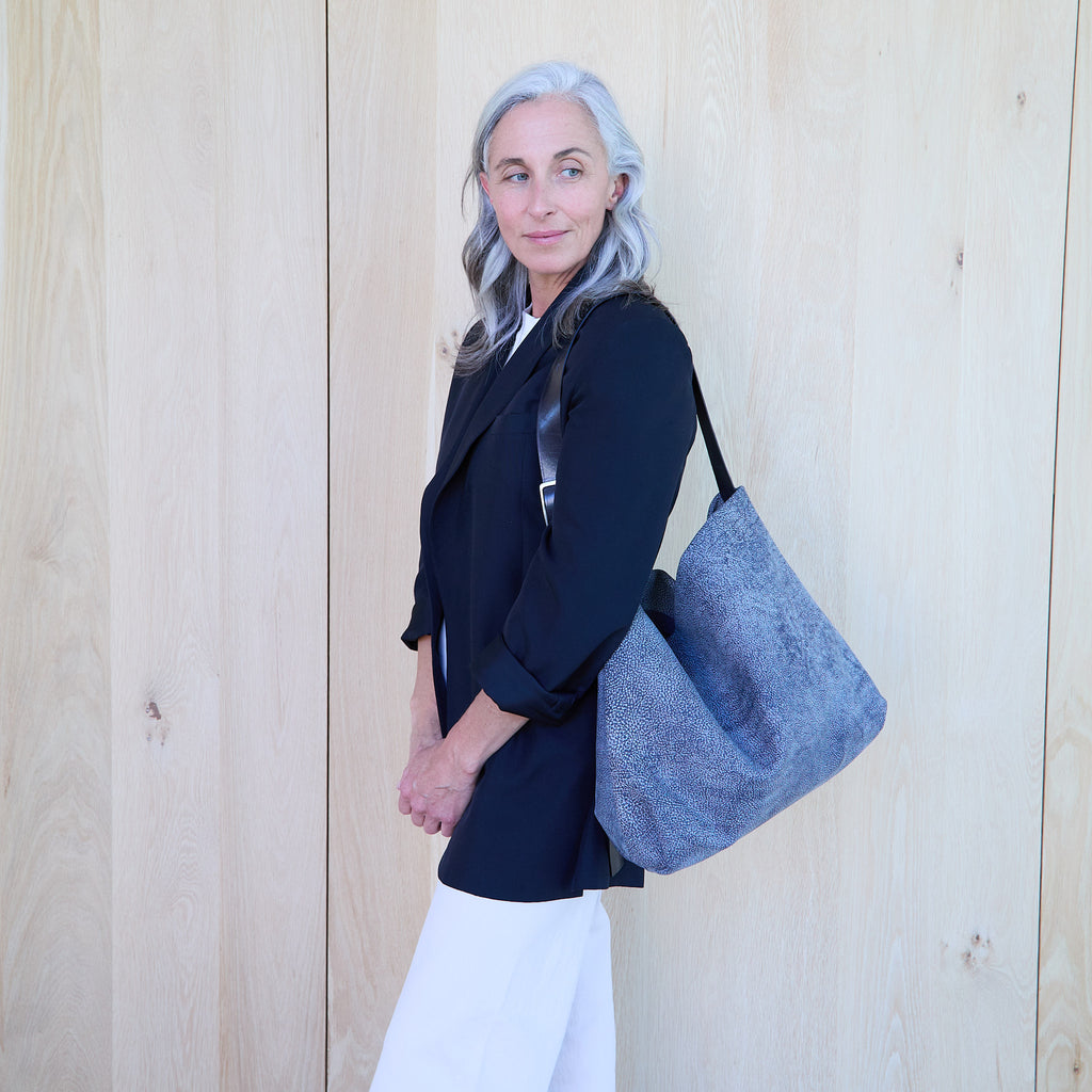 model sitting beside a central boho 