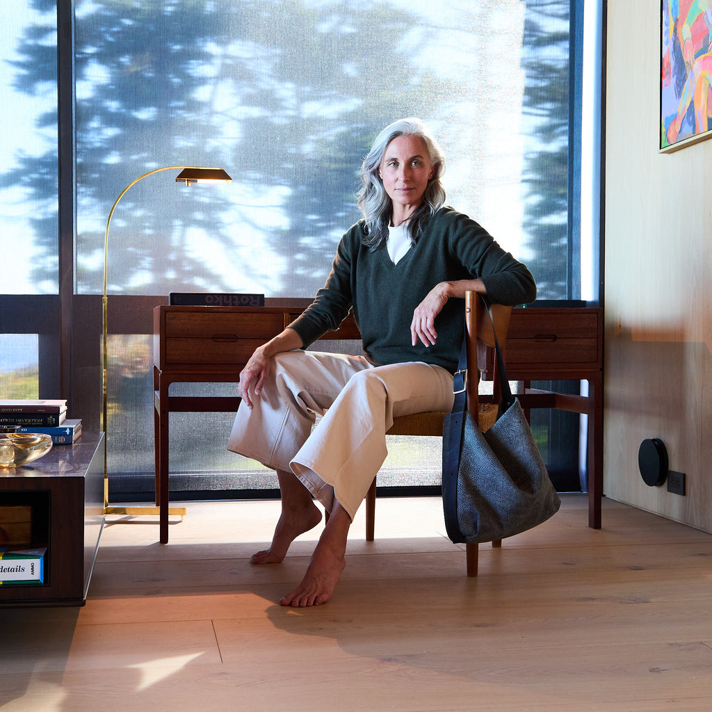 model sitting by central boho 