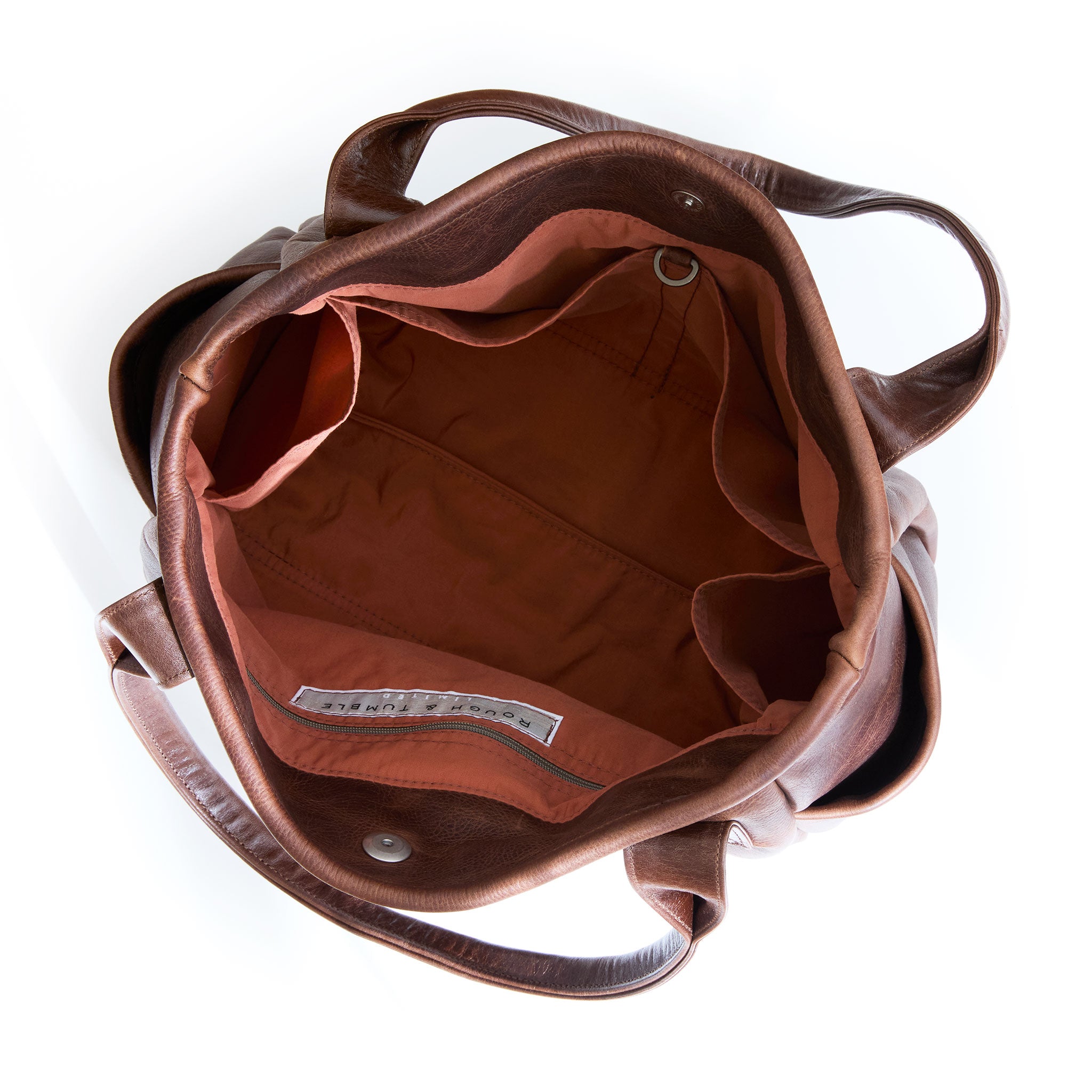 interior shot of bucket tote in fuentes, showcasing interior cider lining and pockets