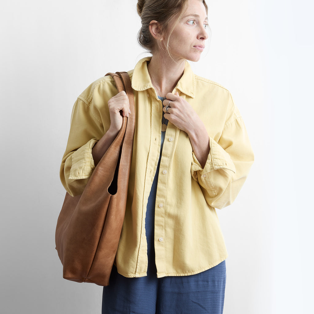 model wearing candid tote in premiums addle 