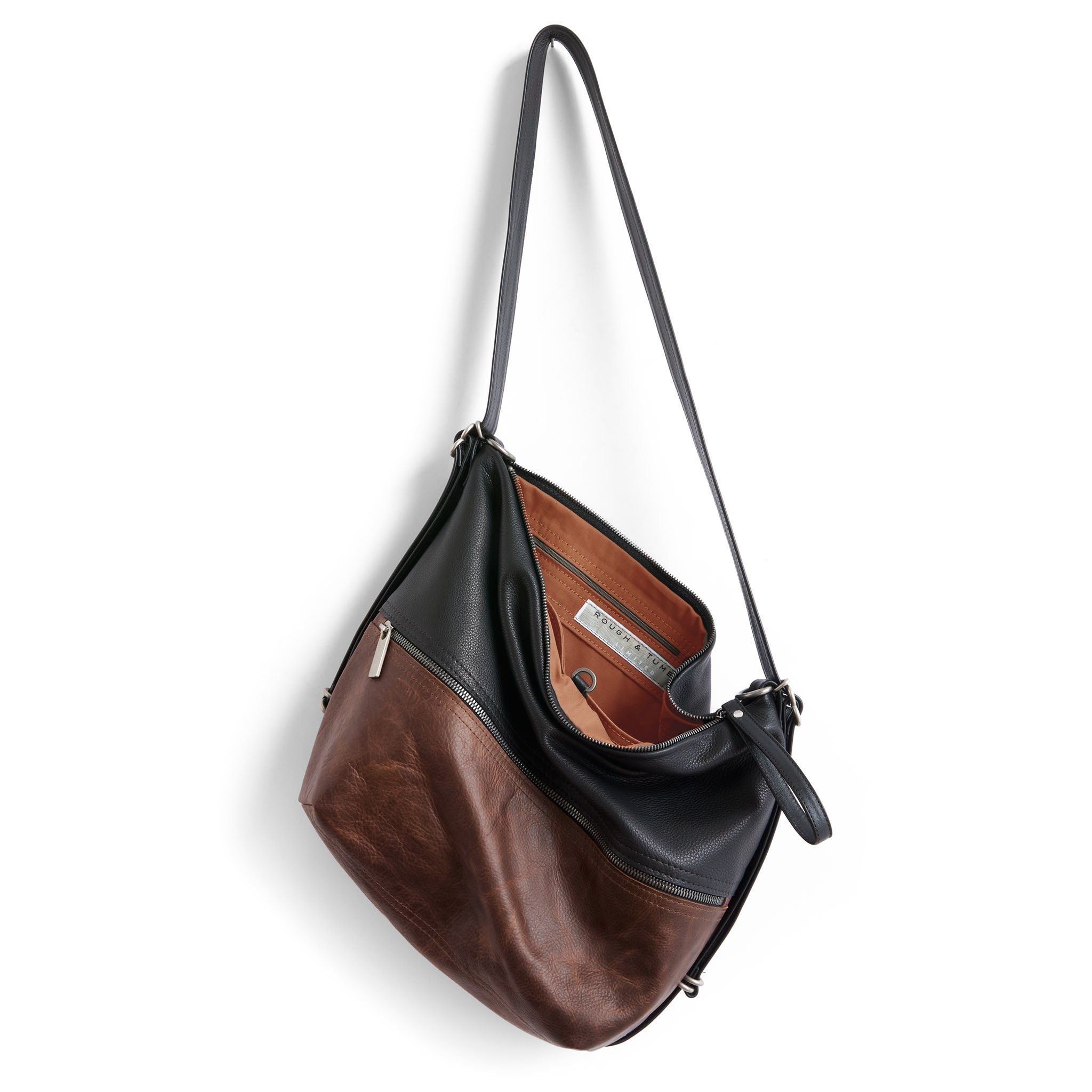 medium city single zip with fuentes base and nero, showcasing interior cider lining and zippered pocket