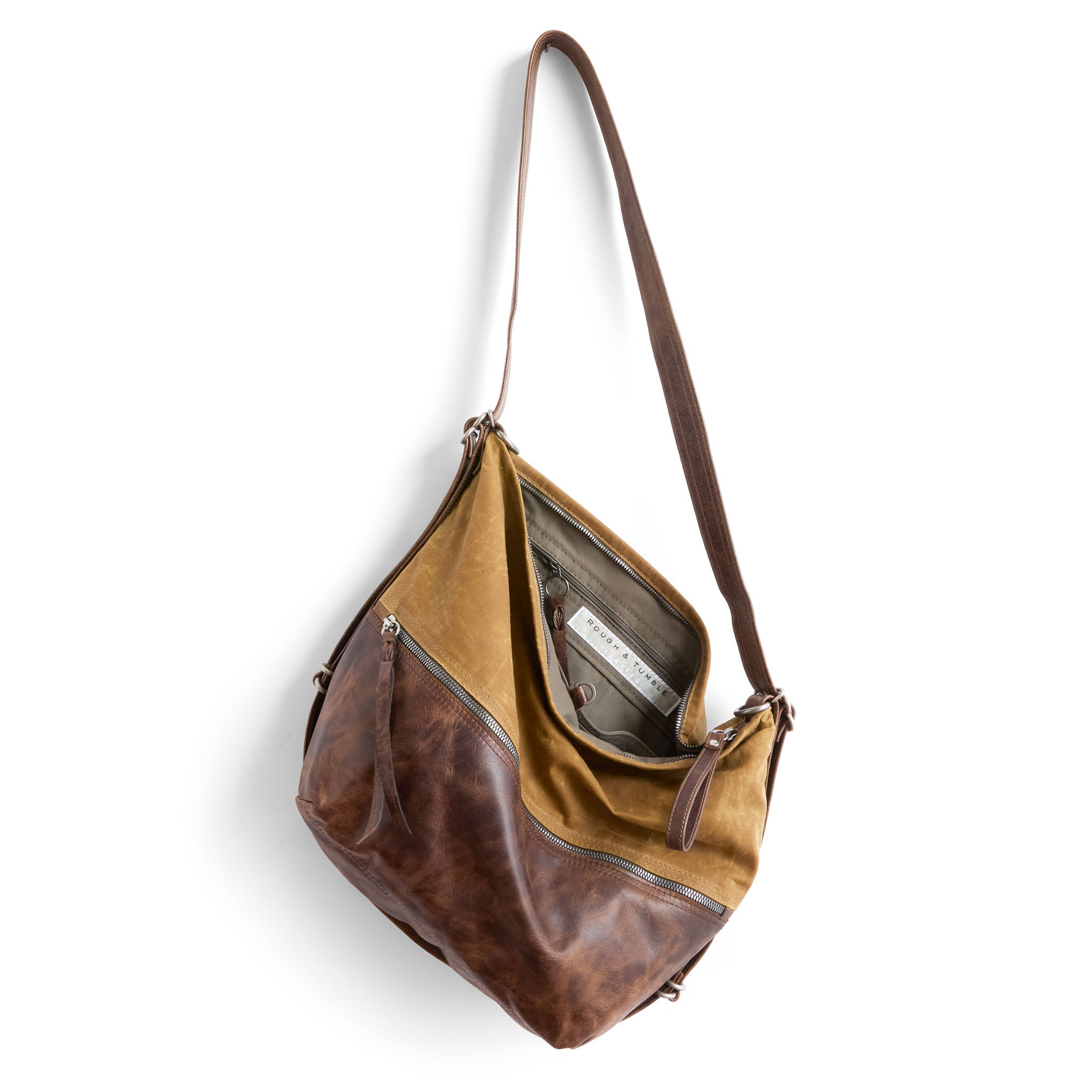 city safari single zip size medium in whiskey waxed canvas and rustic pecan, showcasing interior essex lining and zippered pocket