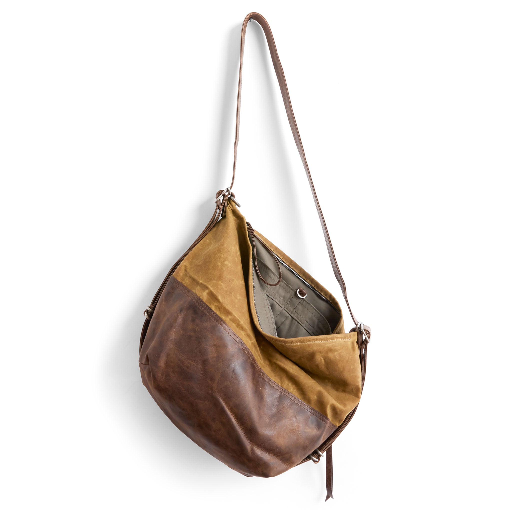 city safari single zip size medium in whiskey waxed canvas and rustic pecan, showcasing interior essex lining and open pockets