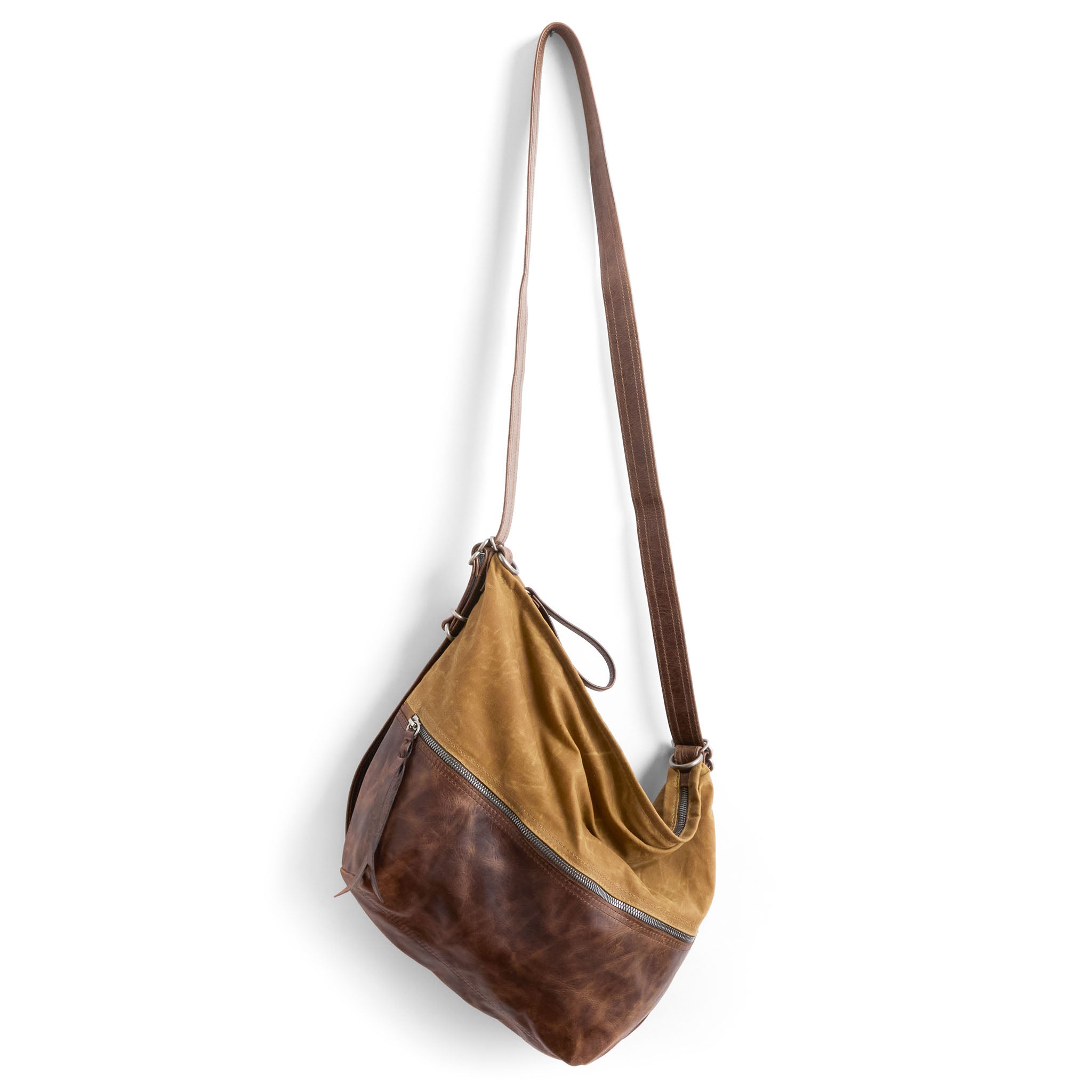 city safari single zip size medium in whiskey waxed canvas and rustic pecan, showcasing extended strap
