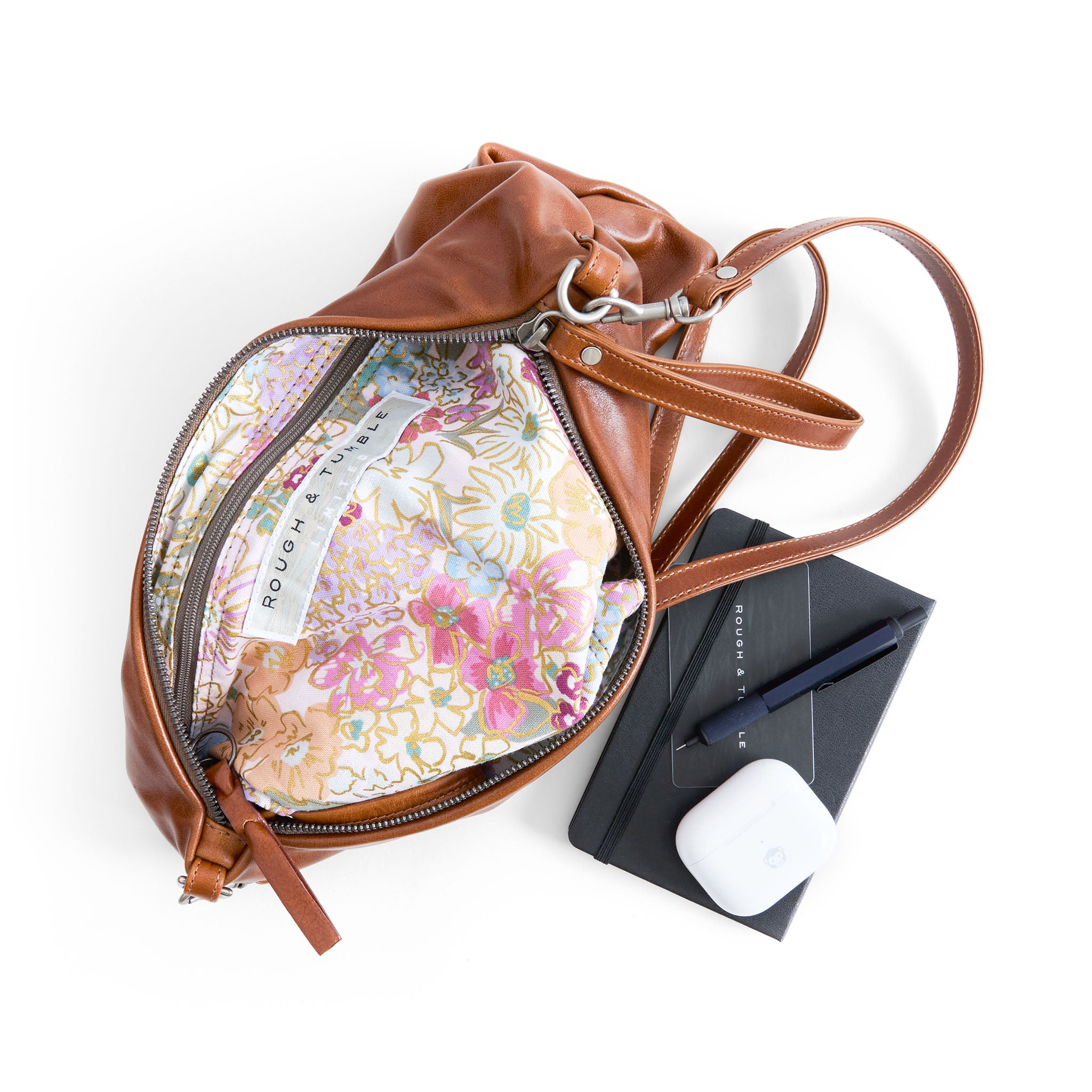 covet in saddle, showcasing interior rifle paper co. mimi plum lining