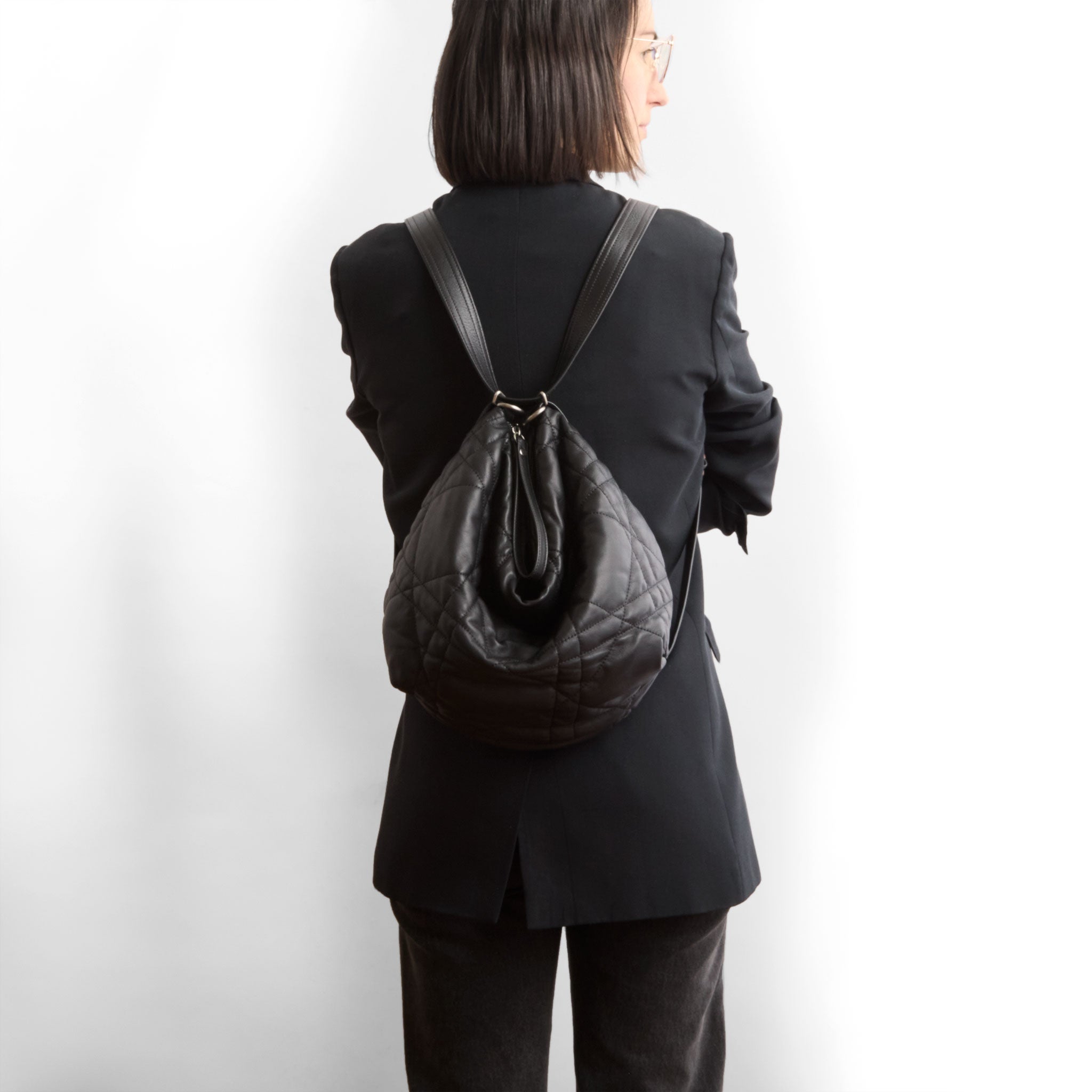 duffel size medium in quilted pashi black, modeled in backpack setting