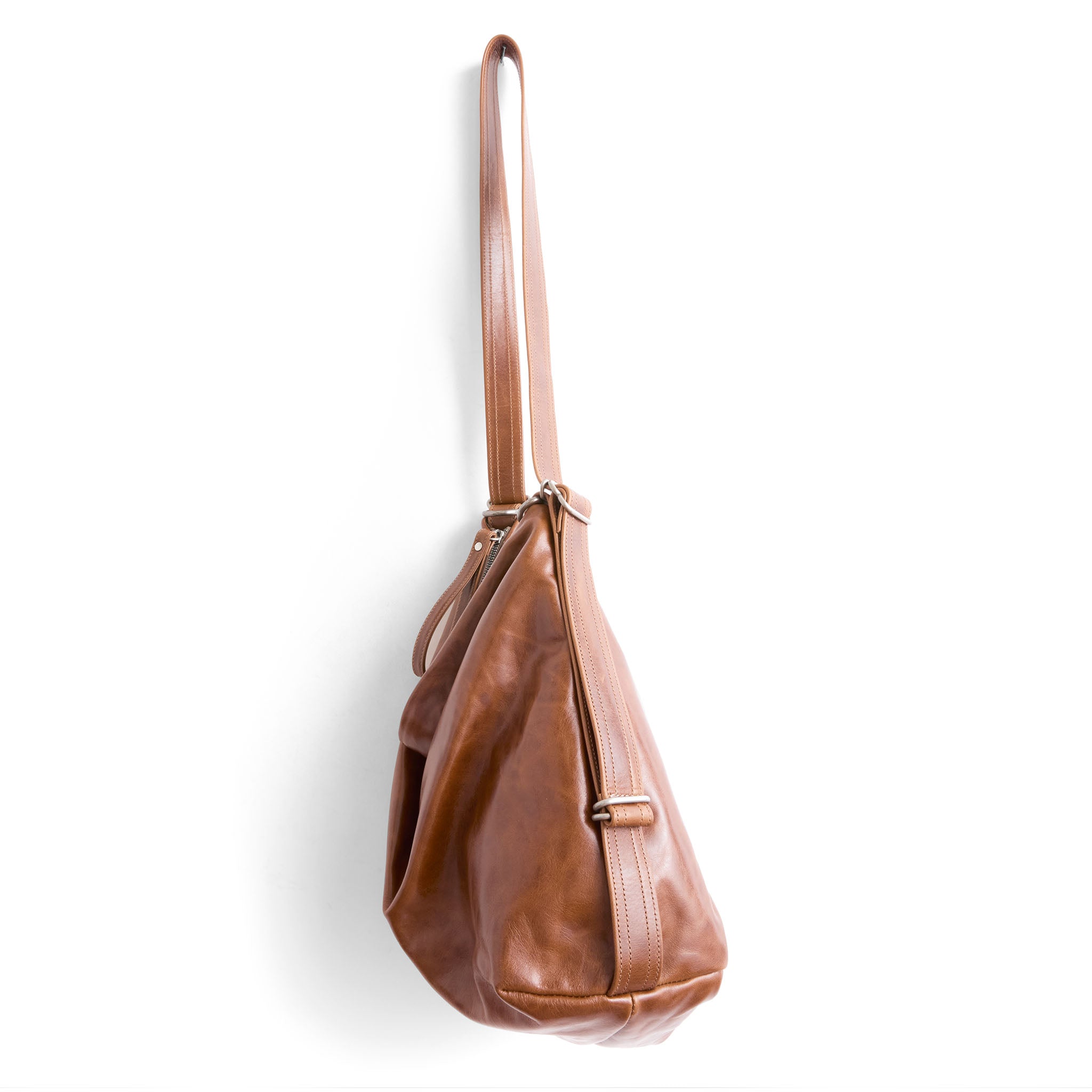 side view of hobo pack size large in saddle