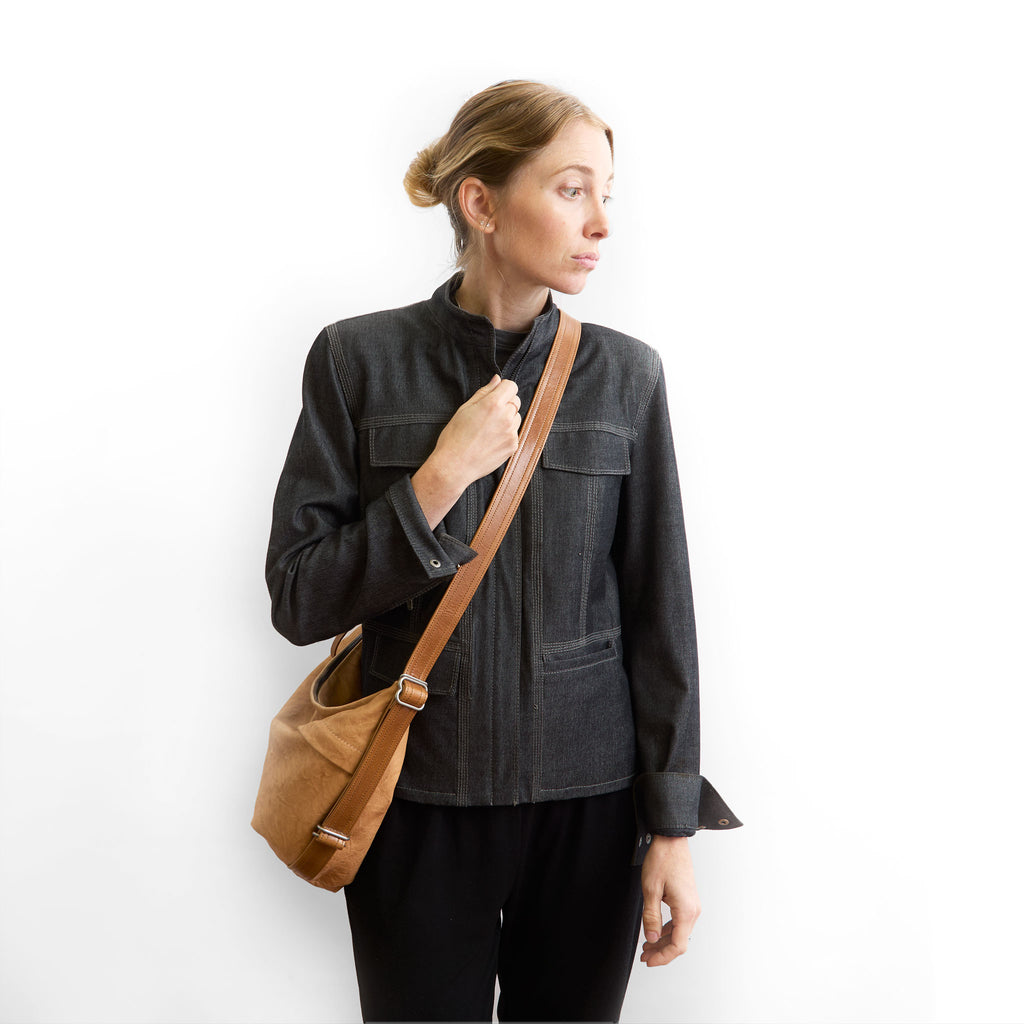 duffel single zip worn as crossbody 