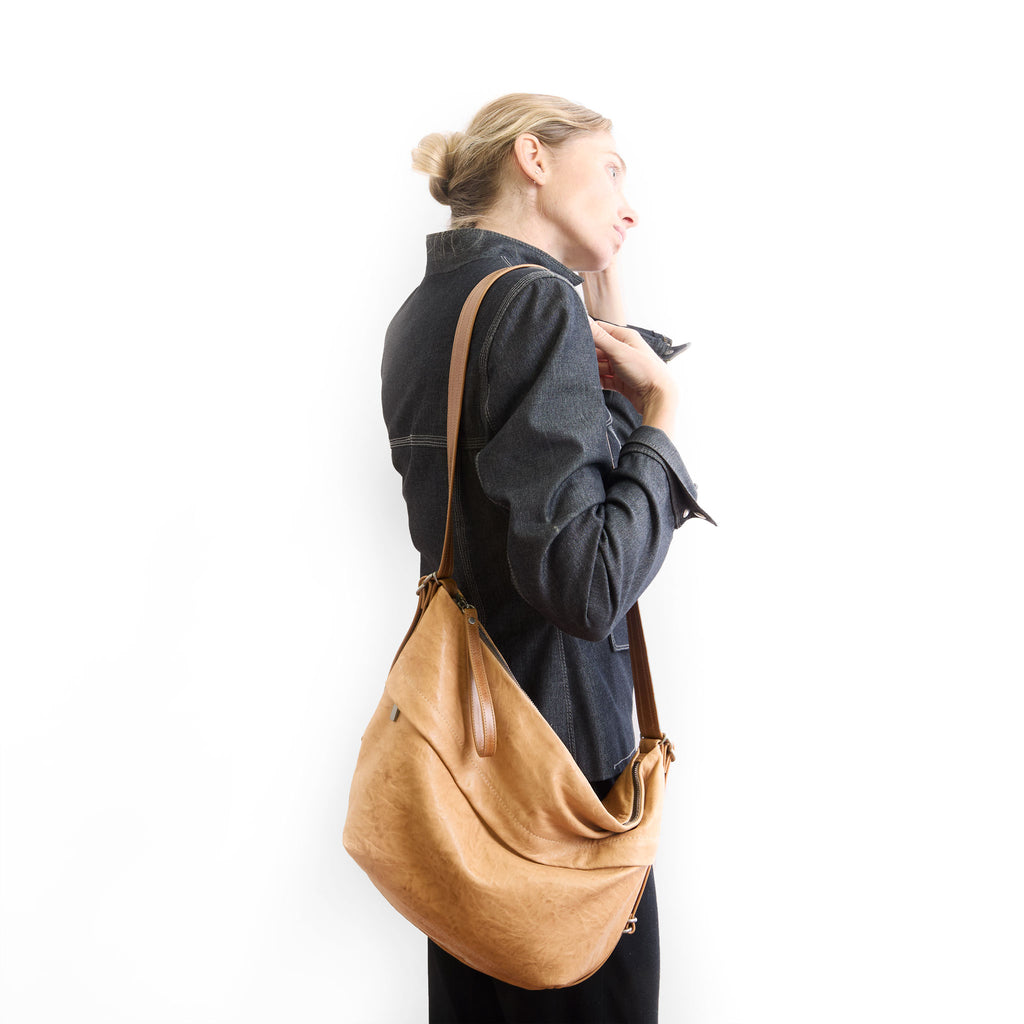 duffel single zip worn as crossbody 