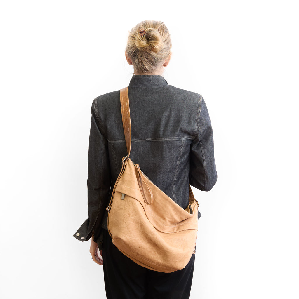 duffel single zip worn as crossbody 