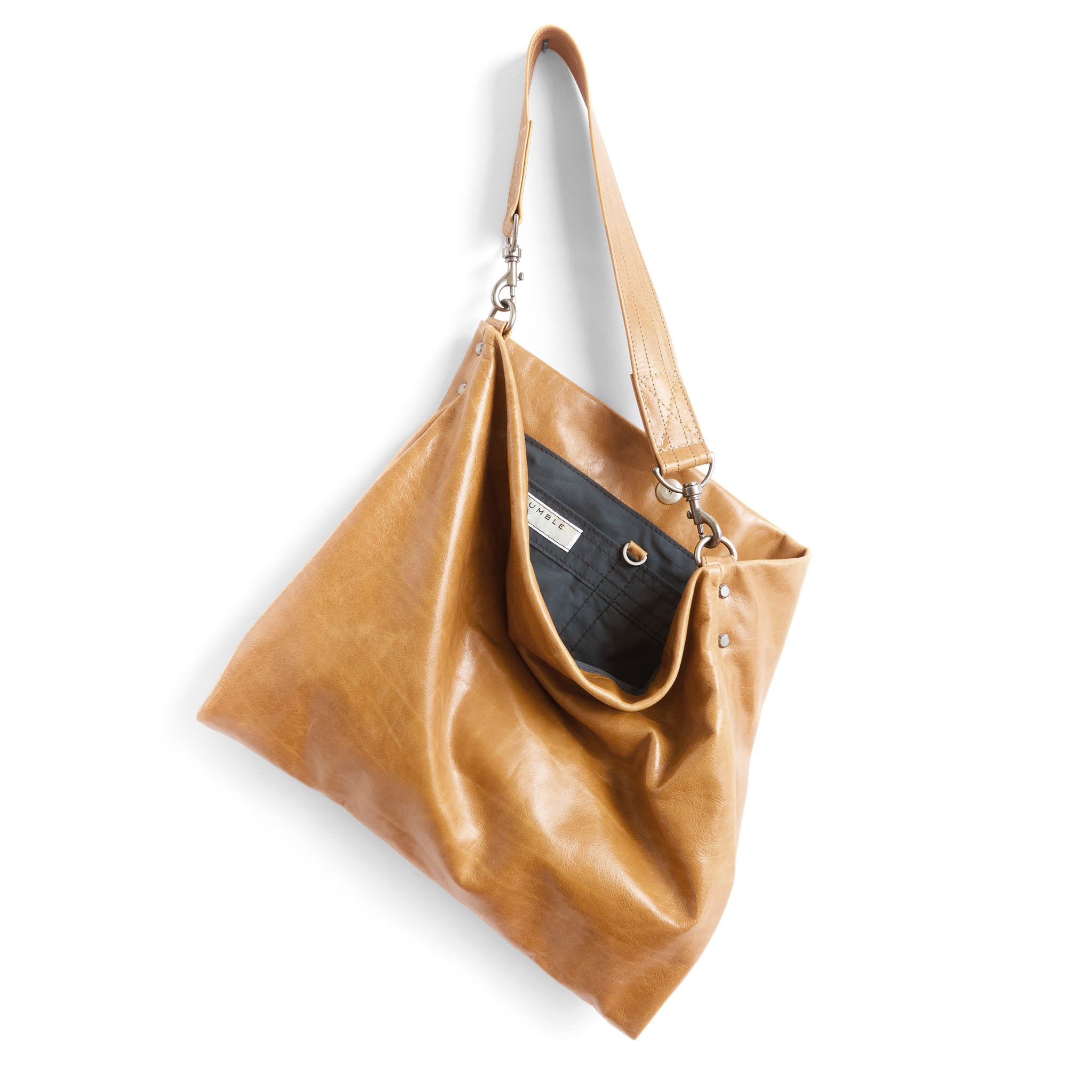 olivia size medium in light saddle, showcasing interior core grey lining