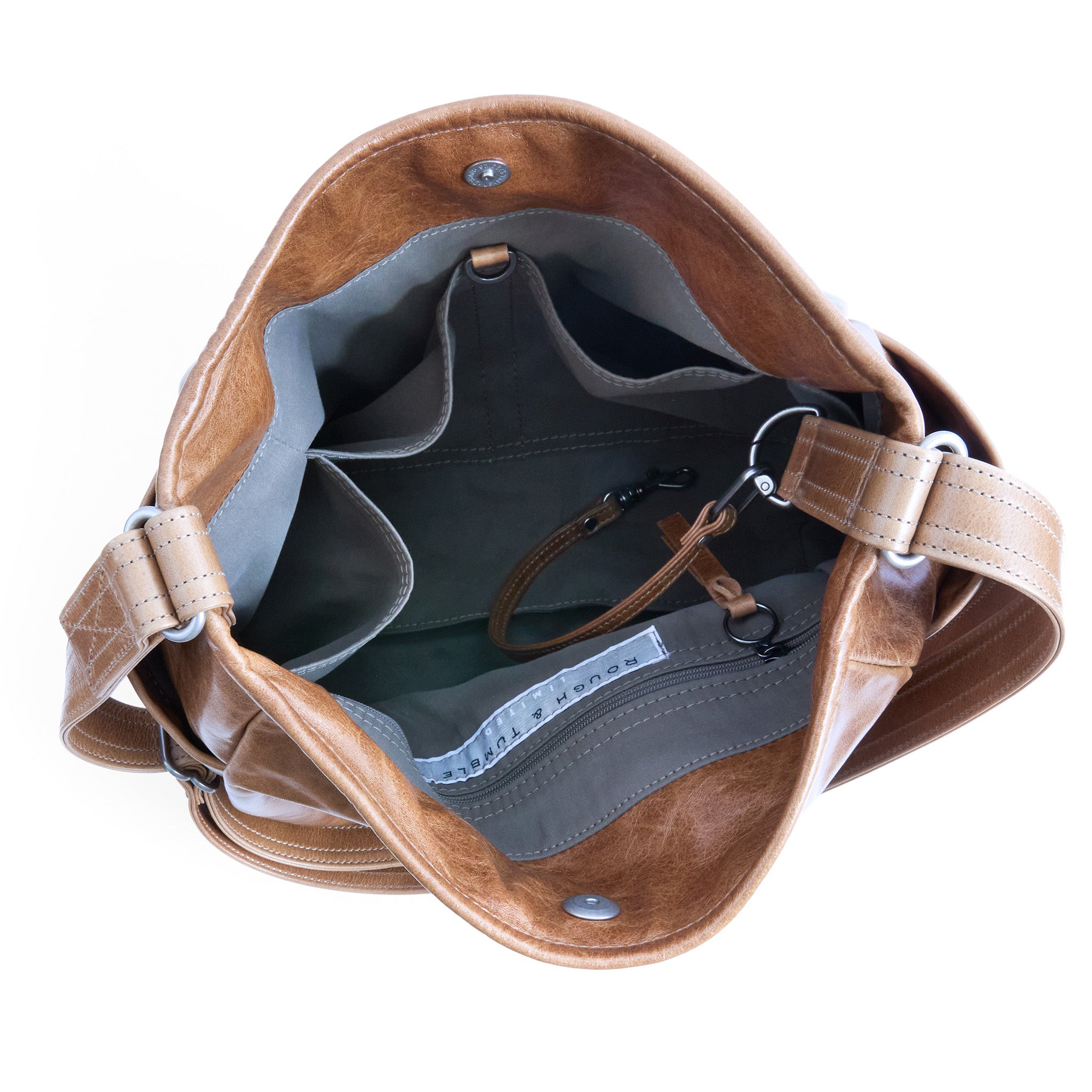 bucket crossbody in light saddle, showcasing interior essex lining and pockets