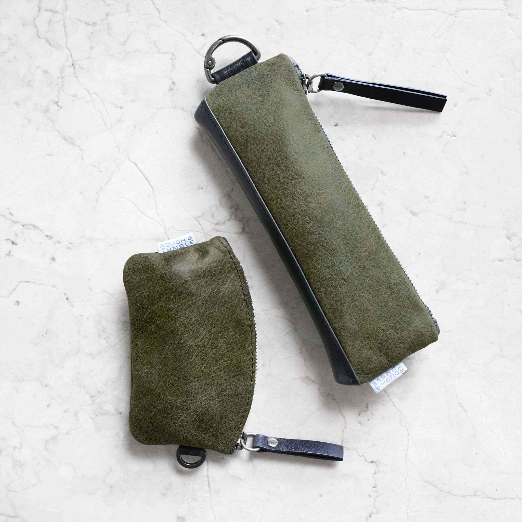 token with pencil case in moss