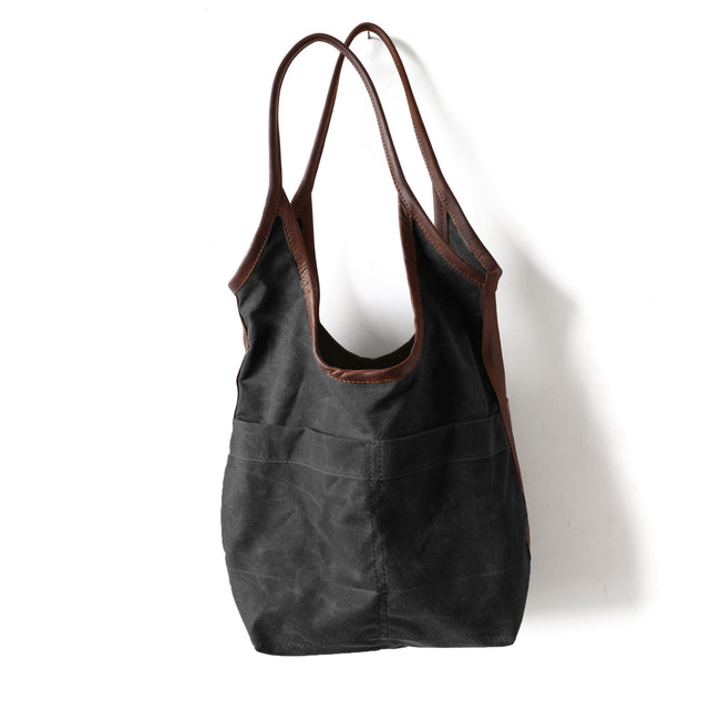 black waxed canvas + fuentes large | canvas sling size medium in black waxed canvas with fuentes strap