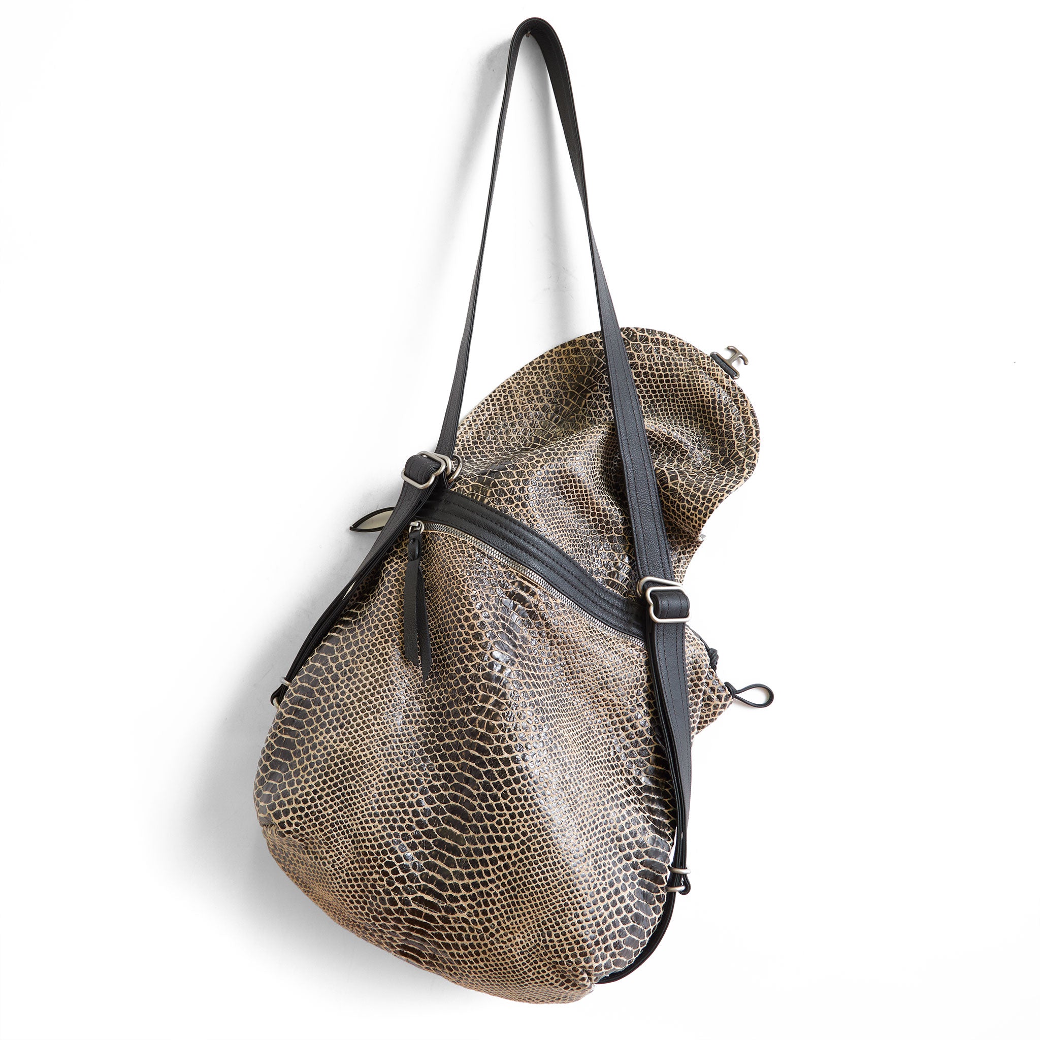 medium 1904 in destroyed soft snake, showcasing back zippered pocket