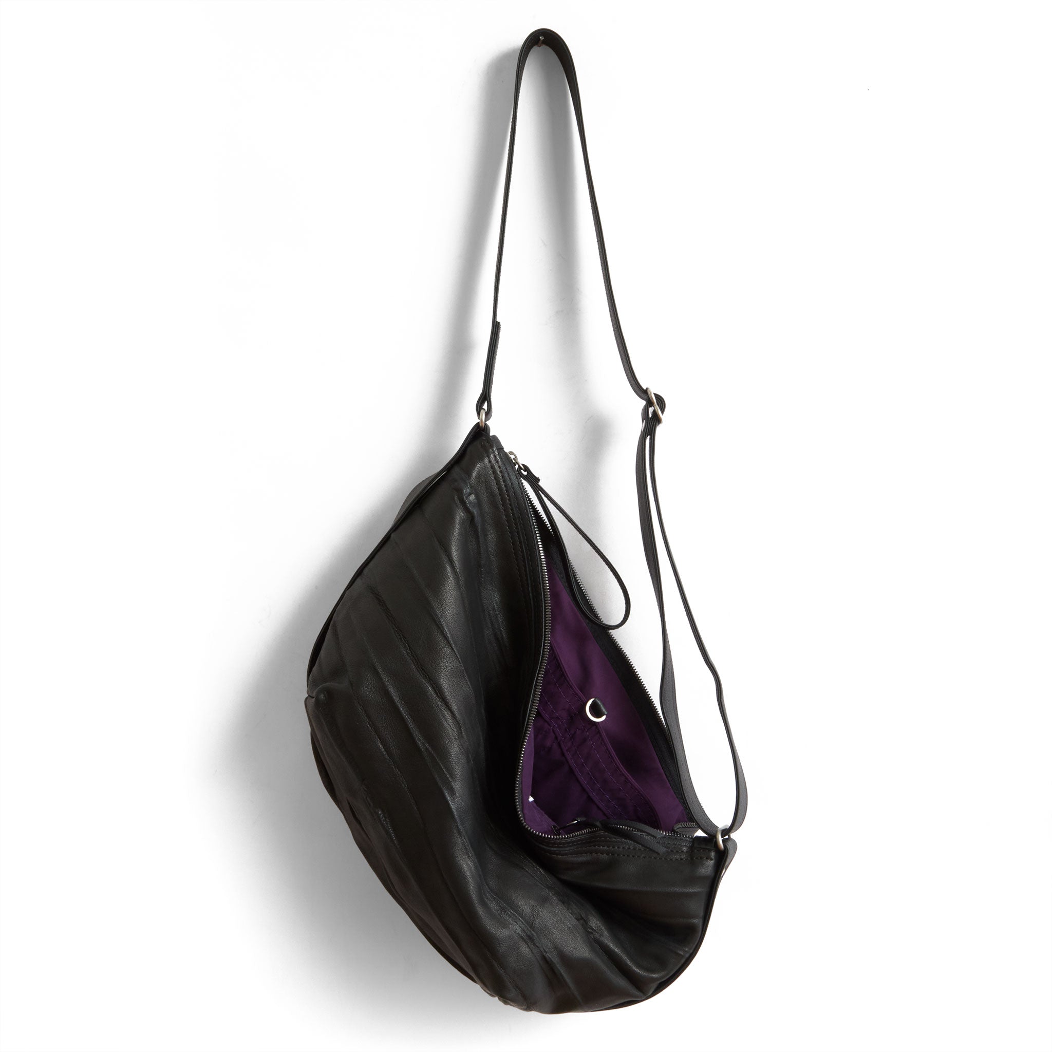 beau duffel in milano black, showcasing interior purple lining and open pockets