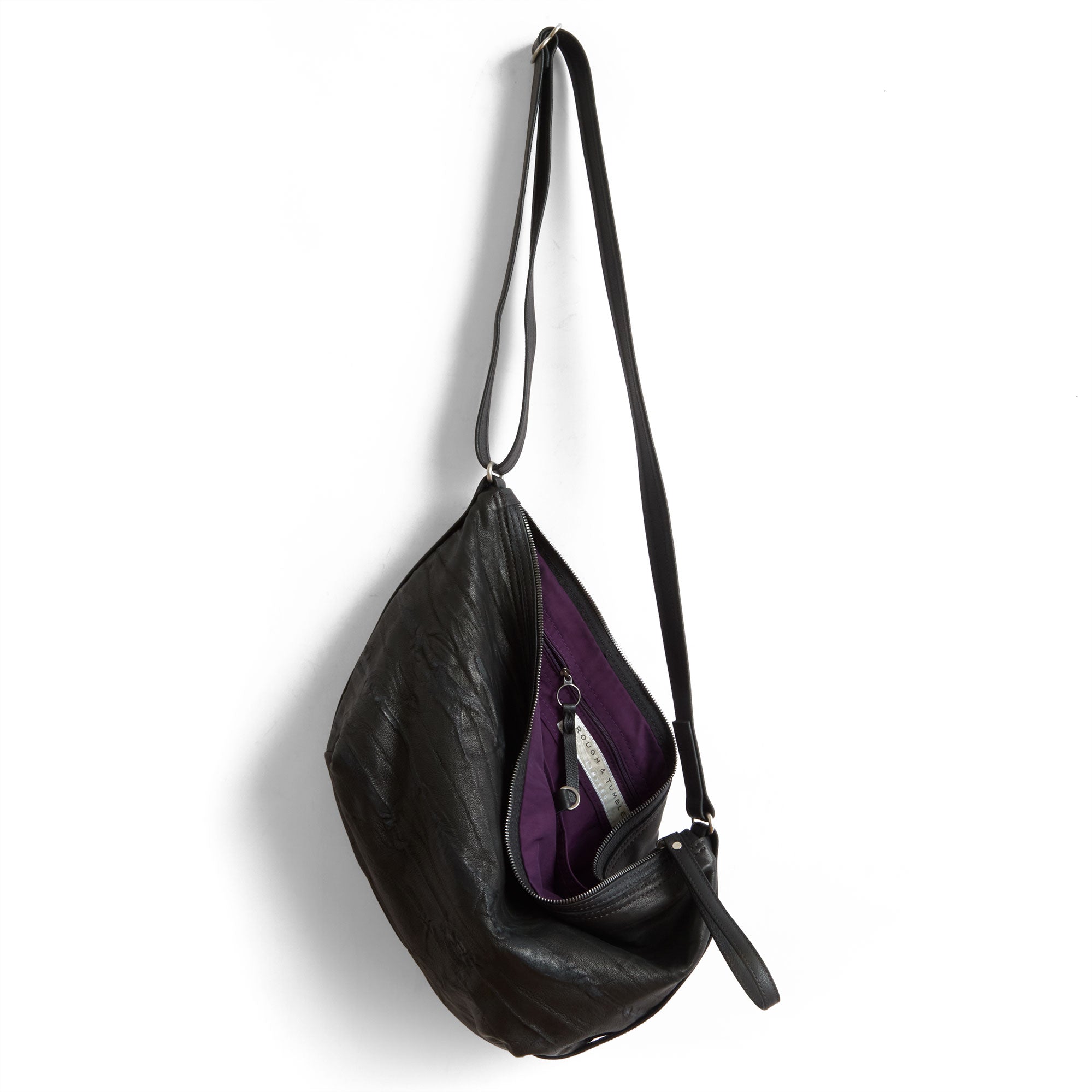 beau duffel in milano black, showcasing interior purple lining and zippered pocket