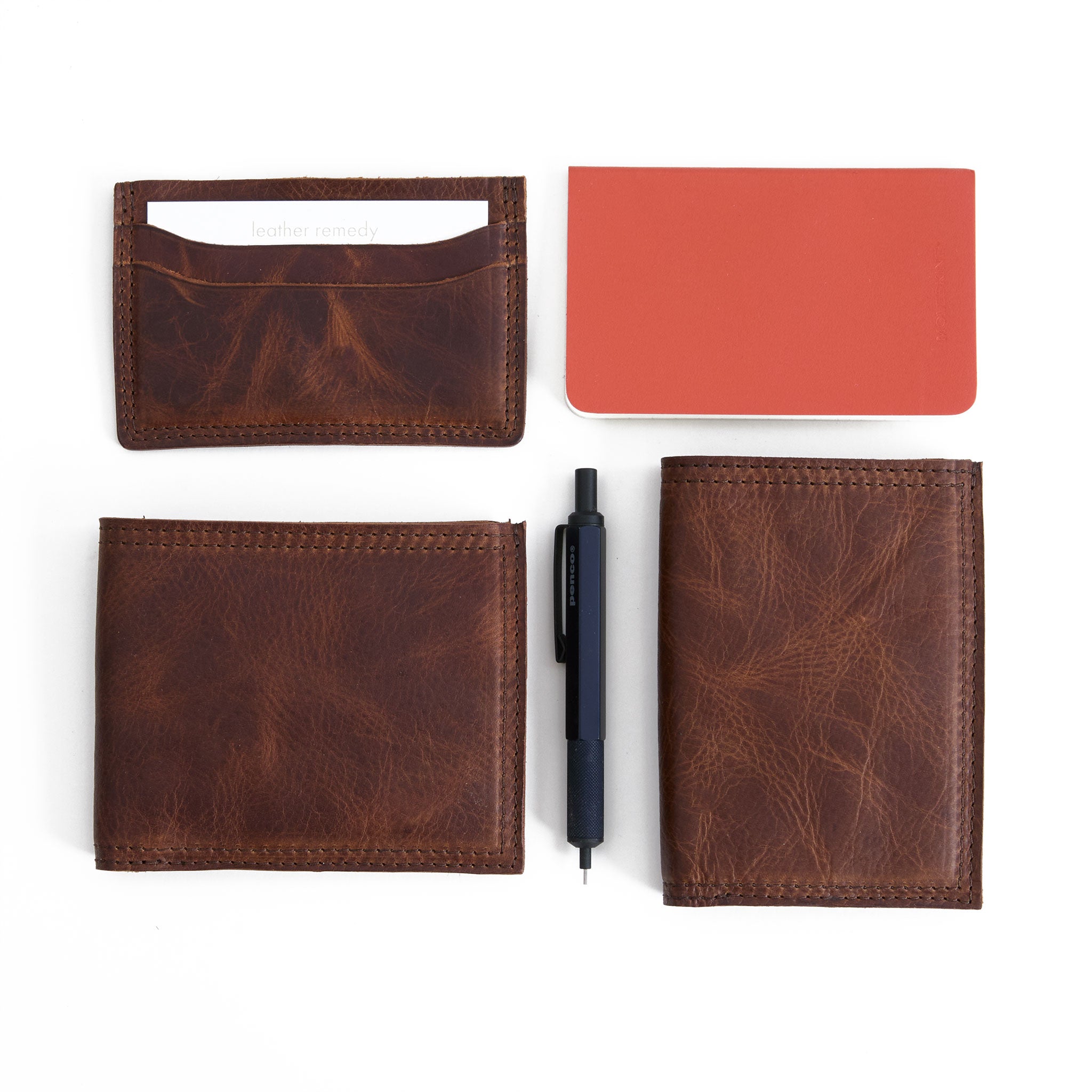  bifold wallet in fuentes in bottom left corner, five slot wallet top left, and slim bifold bottom right