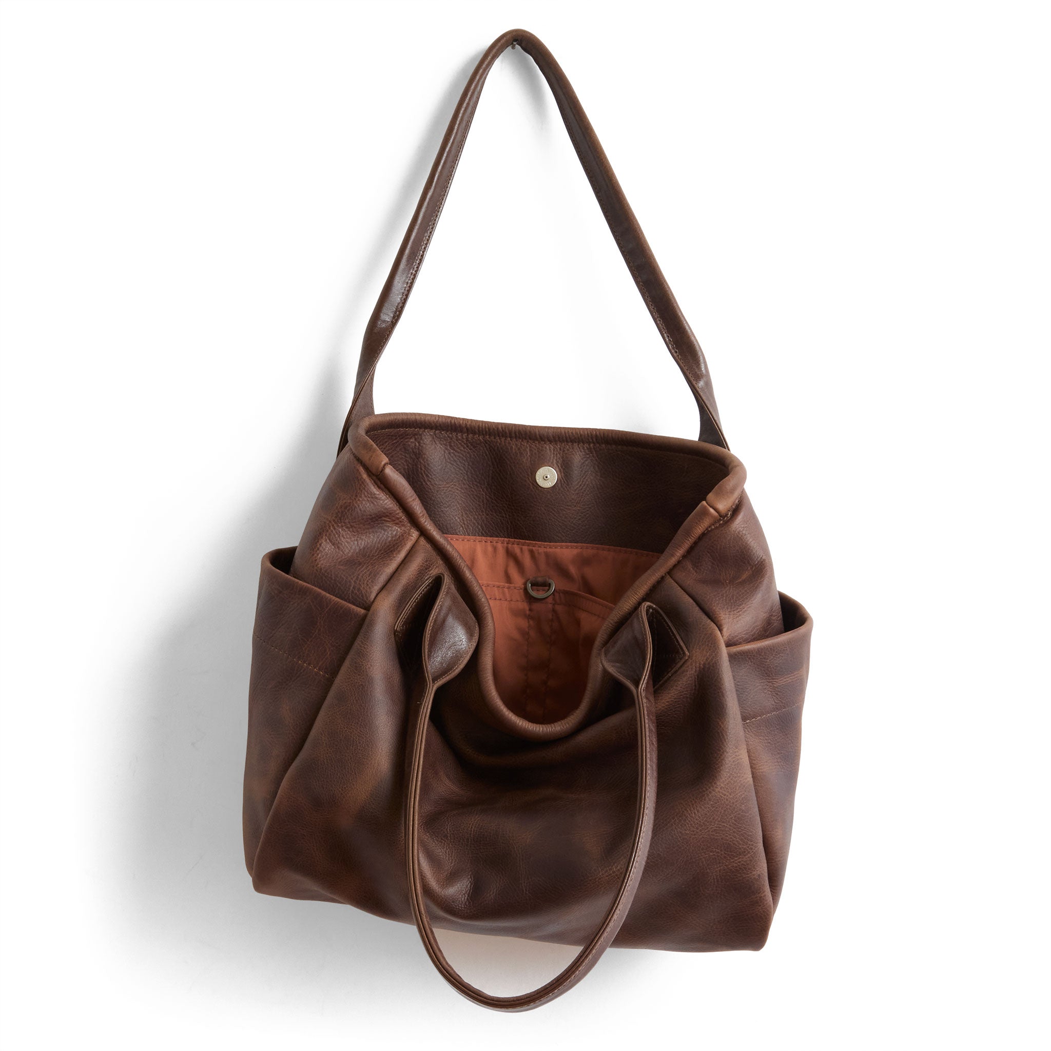 bucket tote in fuentes, showcasing interior cider lining and open pockets