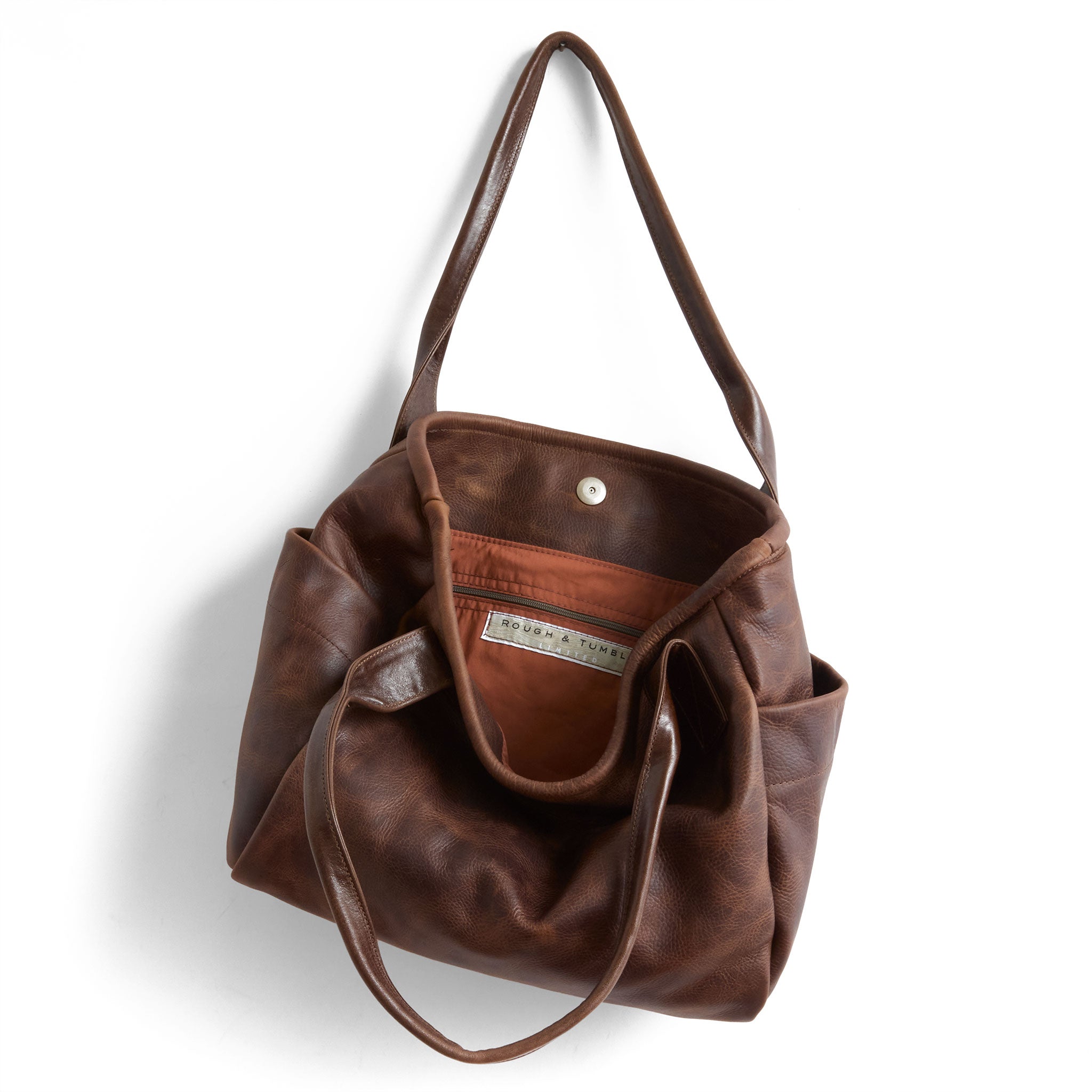 bucket tote in fuentes, showcasing interior cider lining and zippered pocket