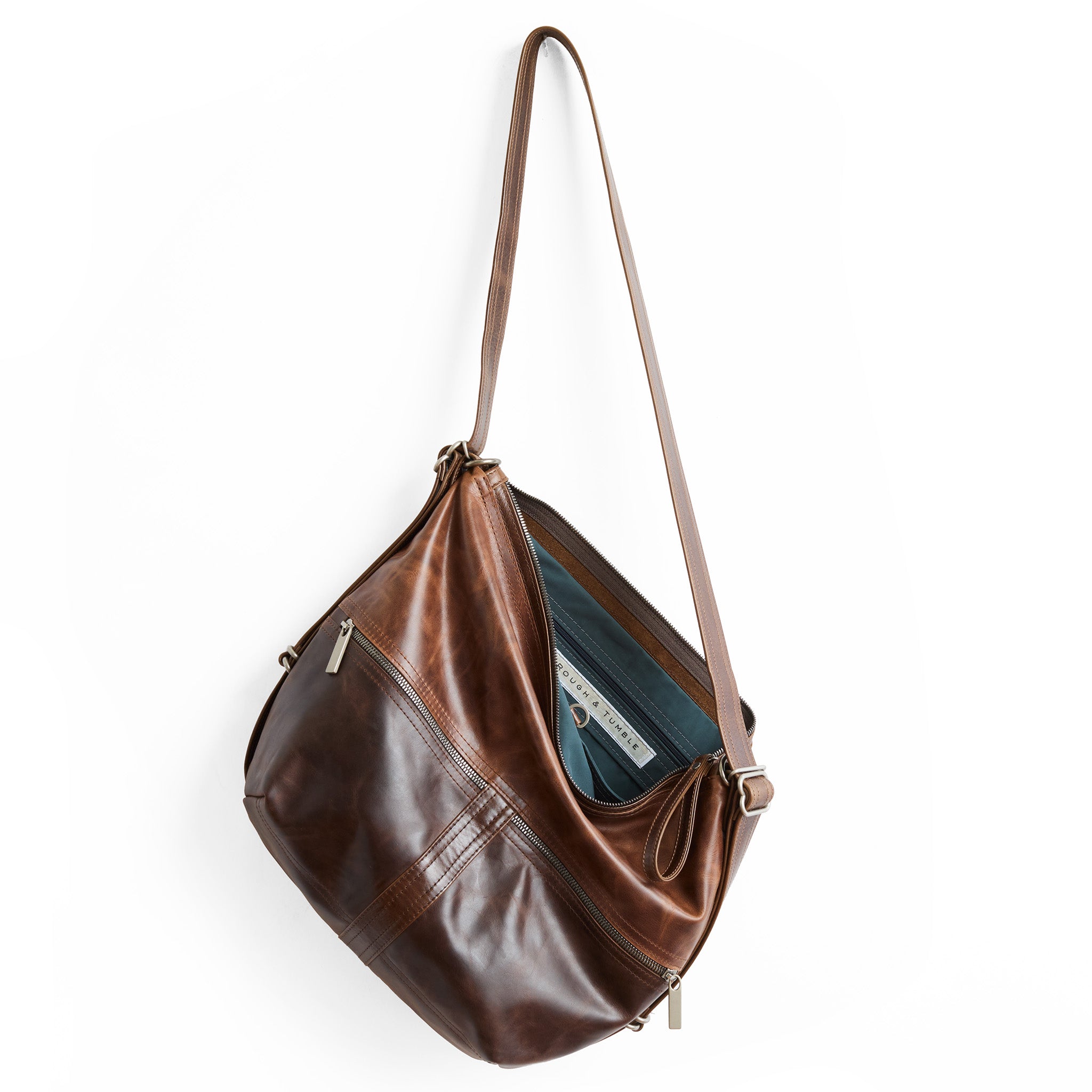 city safari double zip size medium in bourbon, on base, and selkie on top panel. canada blue interior lining.