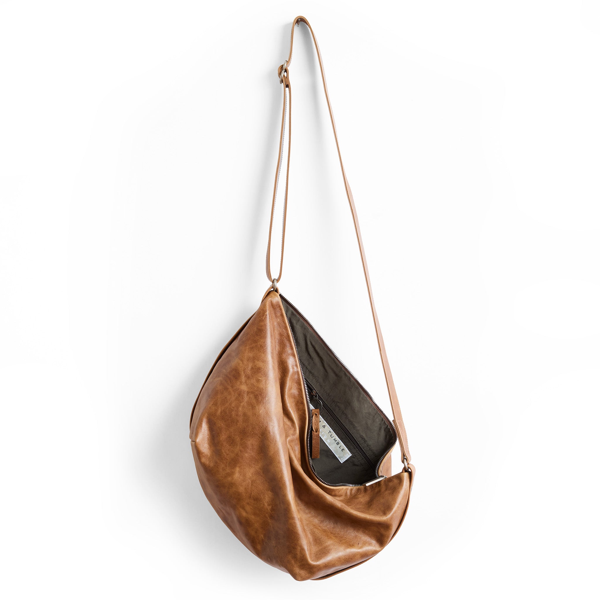 cooper medium in light saddle, showcasing interior slate lining