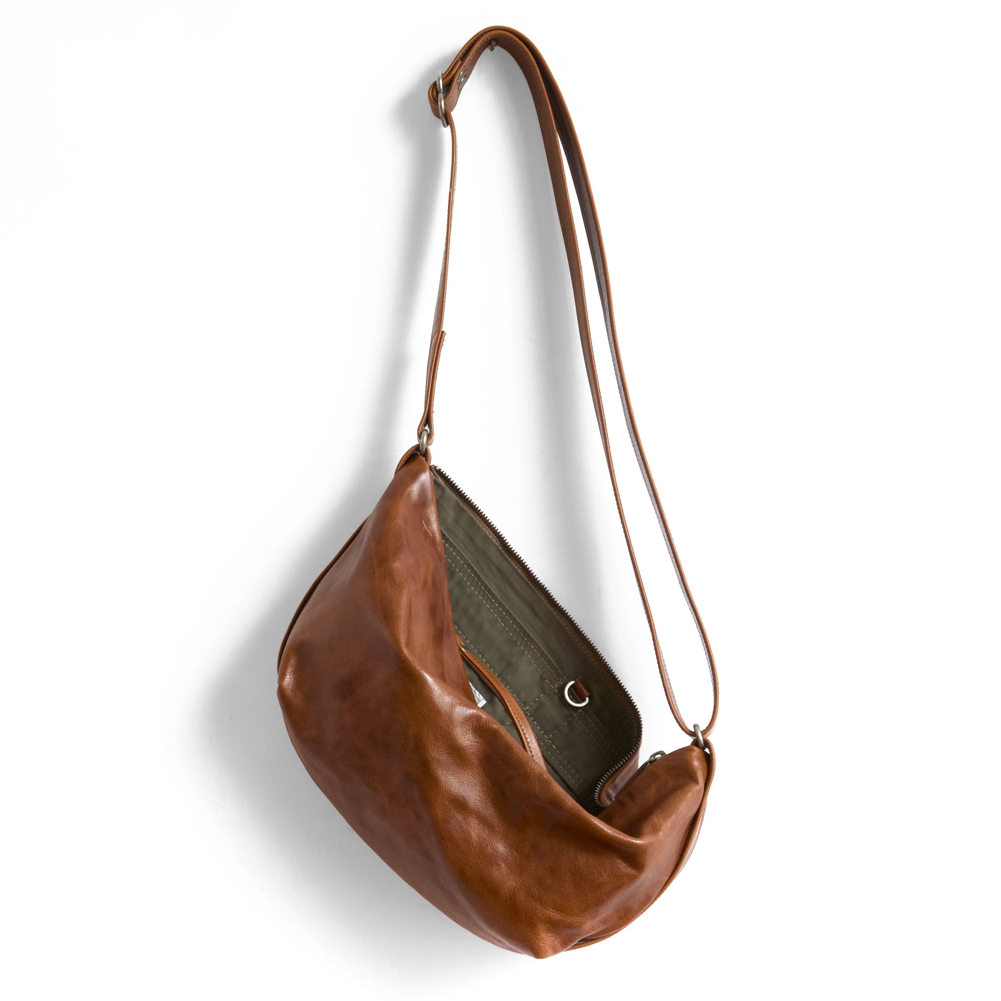 cooper in saddle , showcasing interior essex lining and open pockets