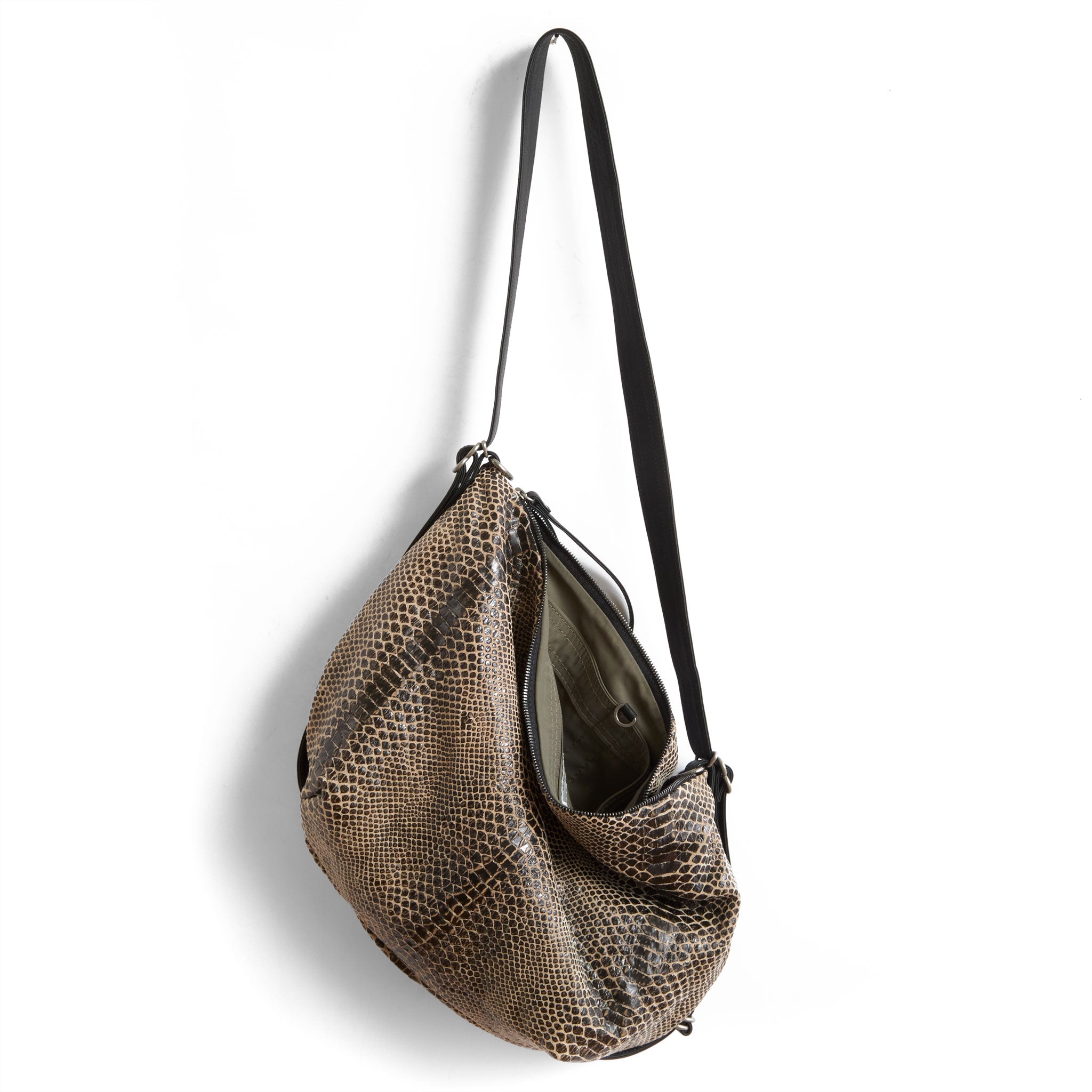 duffel size medium in destroyed snake, showcasing interior open pockets and essex lining