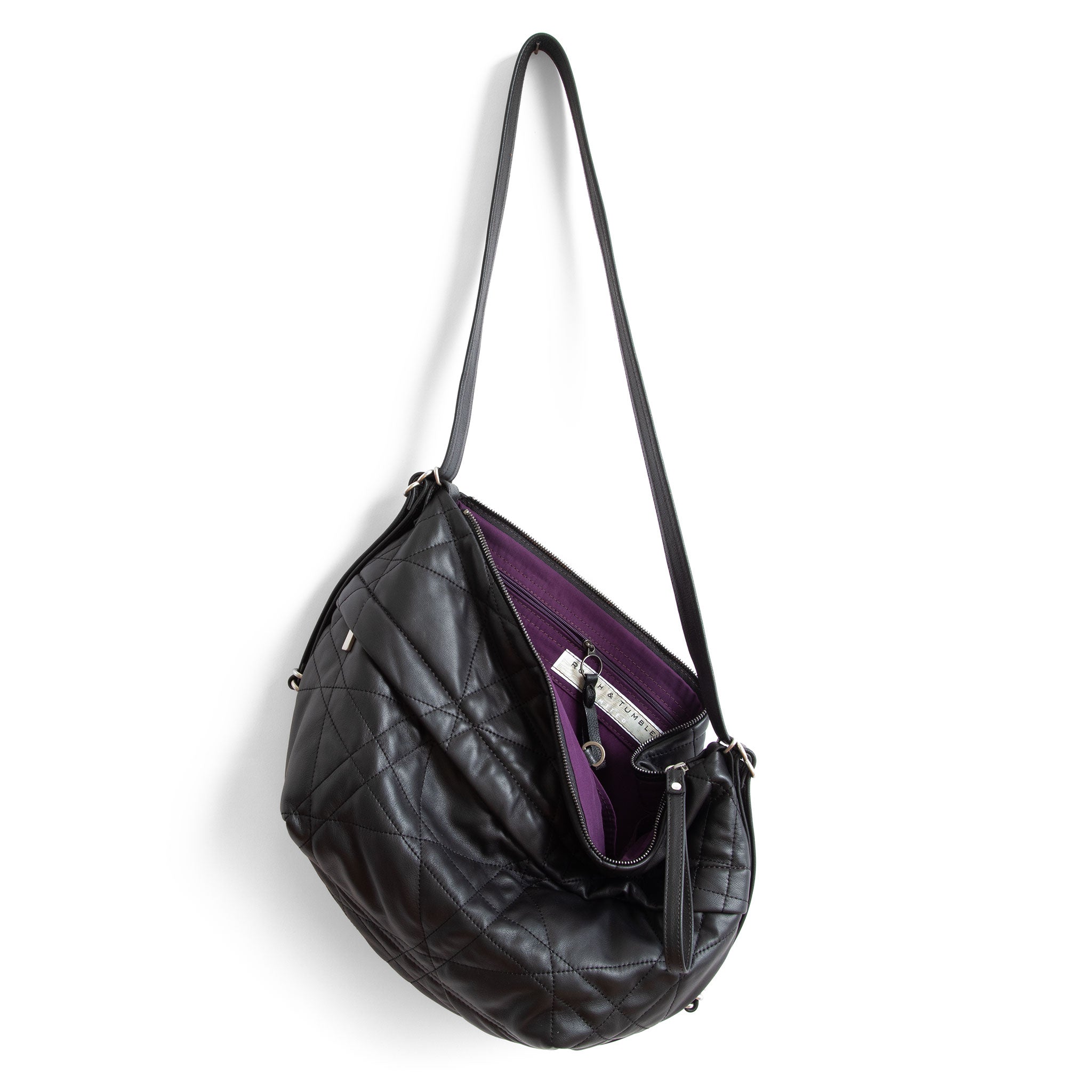 duffel single zip in quilted pashi black, showcasing interior purple lining