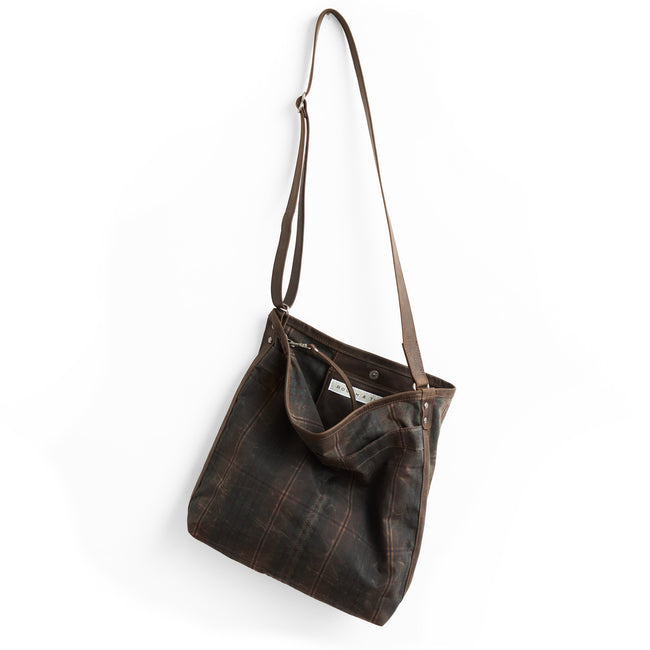 plaid waxed canvas + distressed espresso | lerret in plaid waxed canvas, showcasing interior magnetic closure and phone pocket