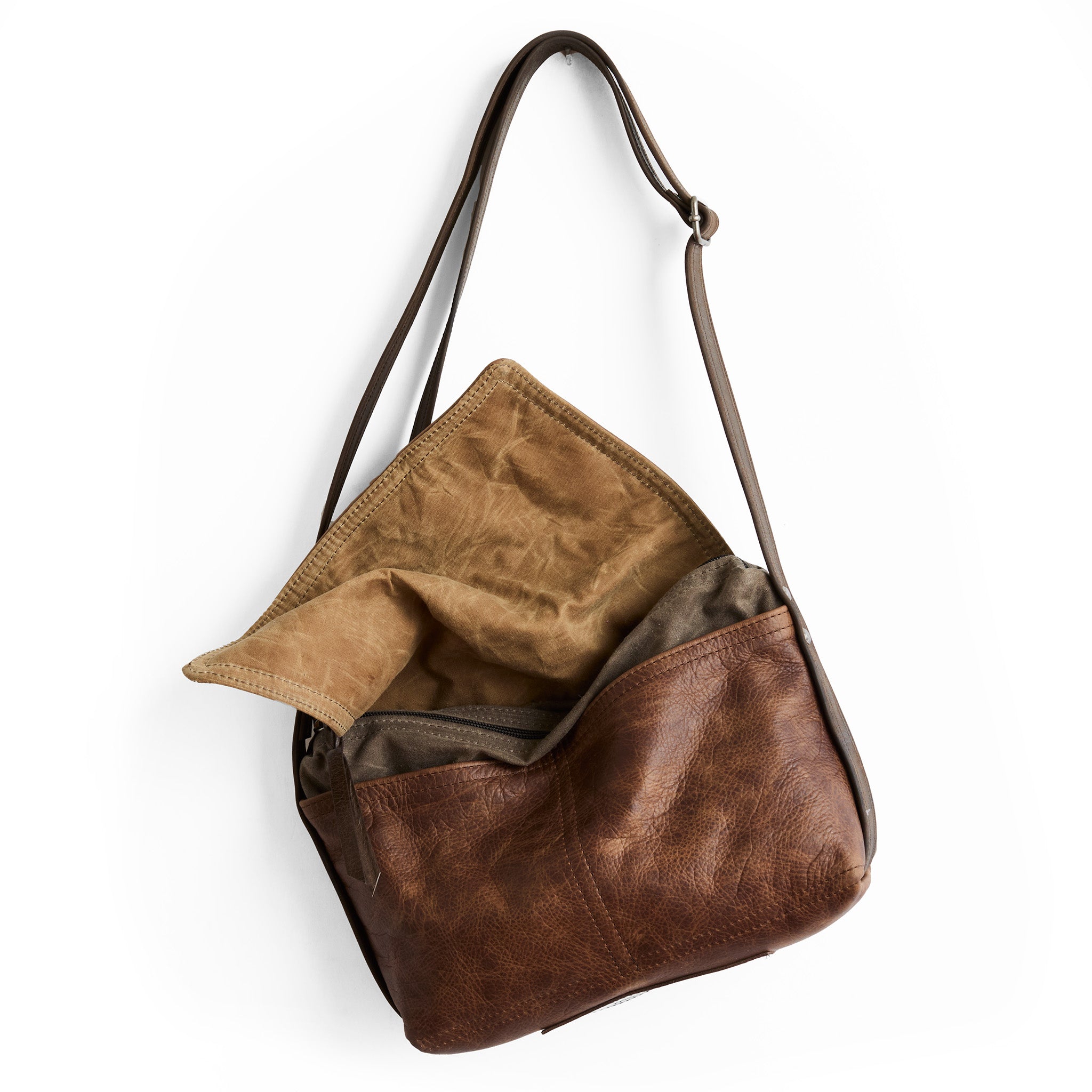 little book bag in fuentes, showcasing open pockets under flap