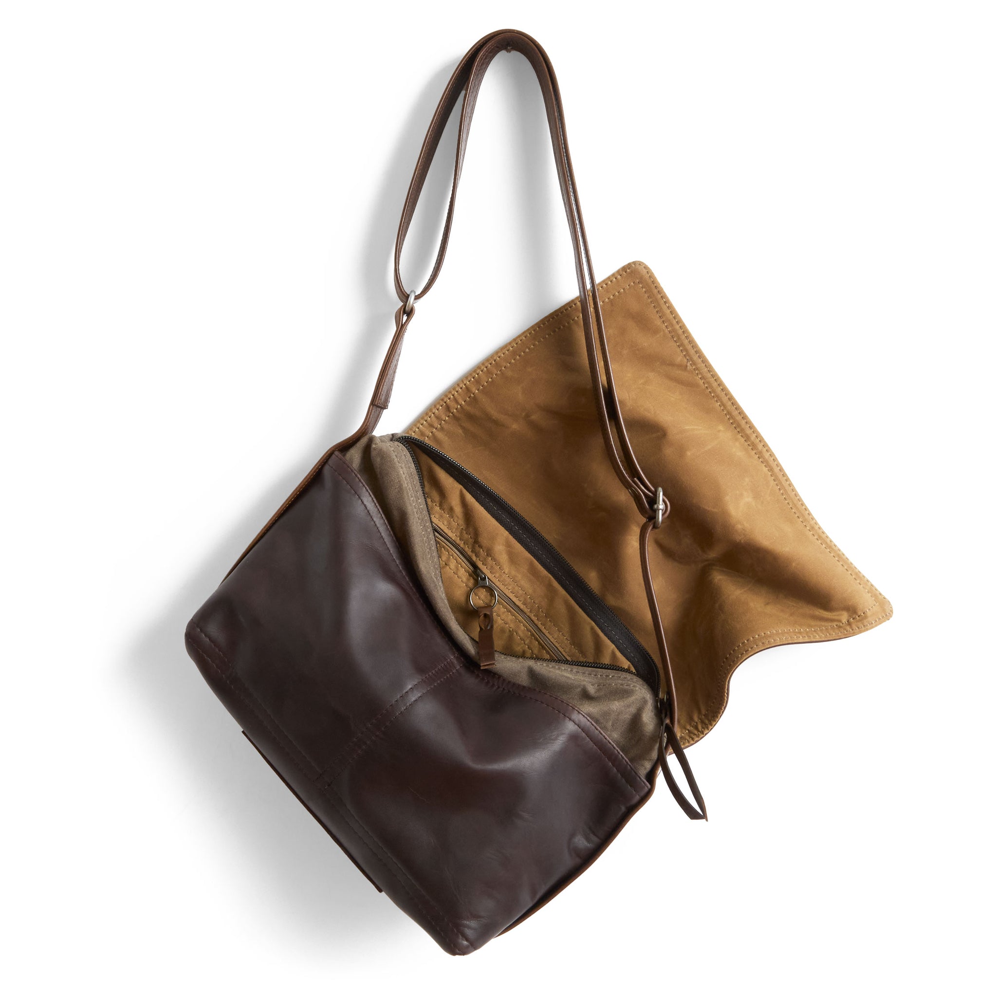 little book bag in pure earth, showcasing interior flap lined in sienna waxed canvas, interior zippered pocket, and open pockets