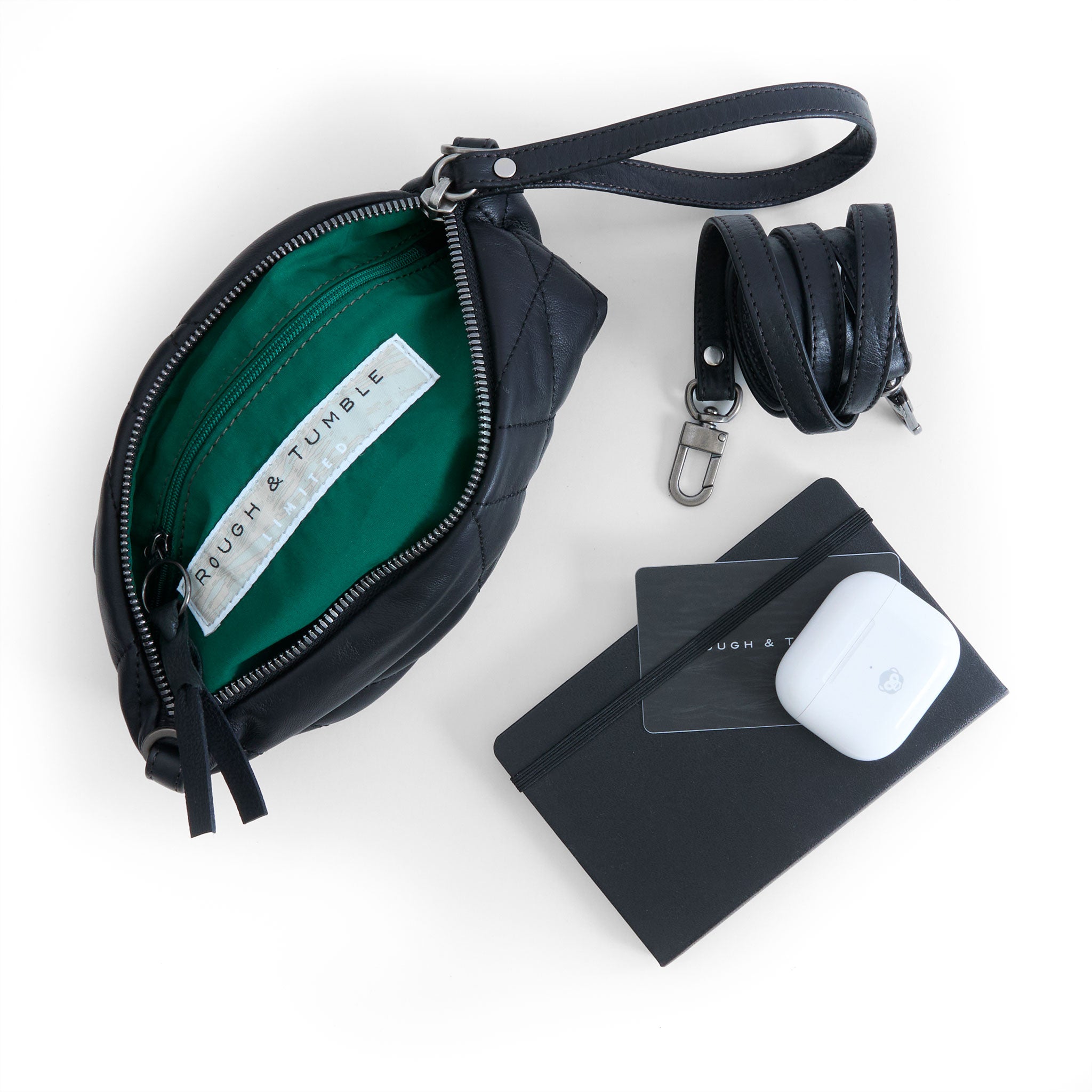 pinched bottom traveler in quilted pashi black, showcasing interior meadow lining and zippered pocket