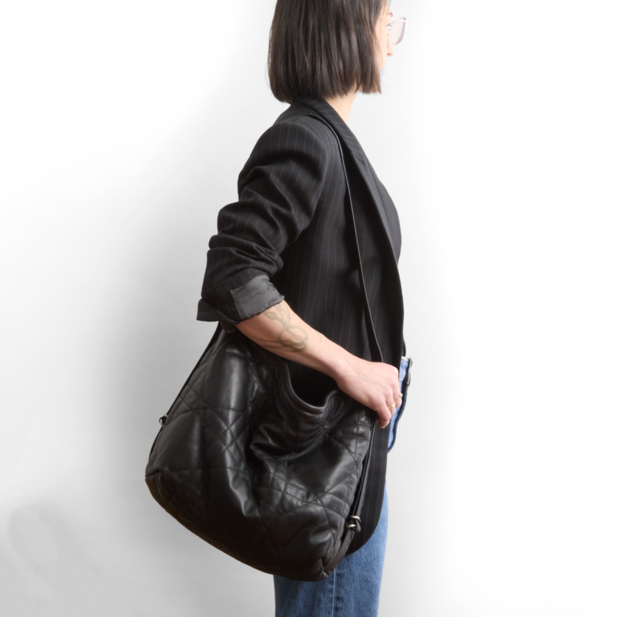 boho e+w size large in quilted pashi black being modeled in shoulder setting