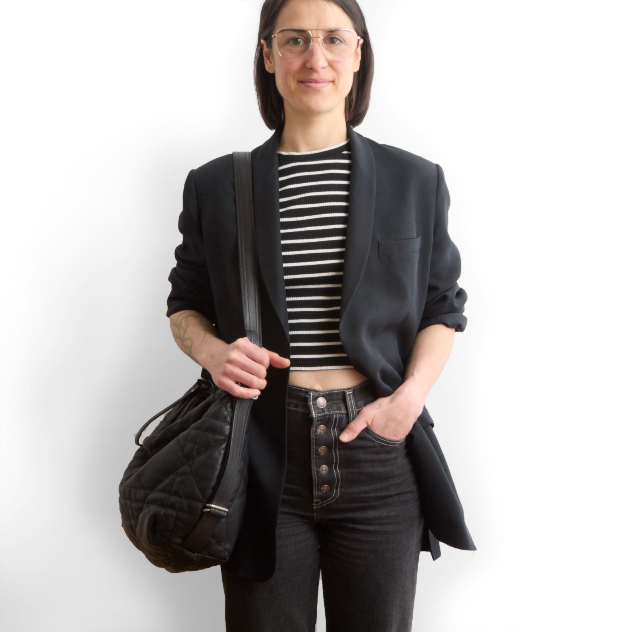 duffel size medium in quilted pashi black, modeled in shoulder setting