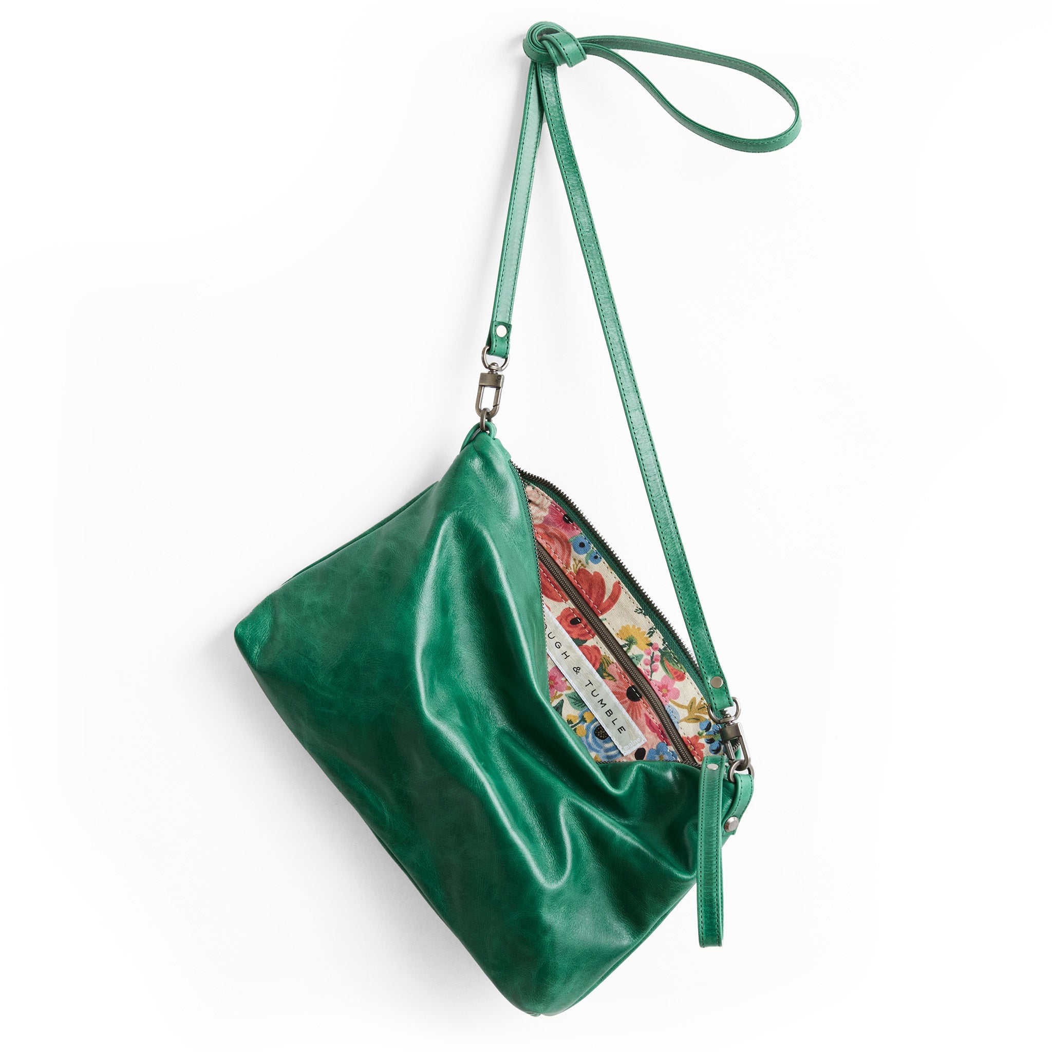 traveler in emerald, showcasing interior rifle paper co. garden party coral lining