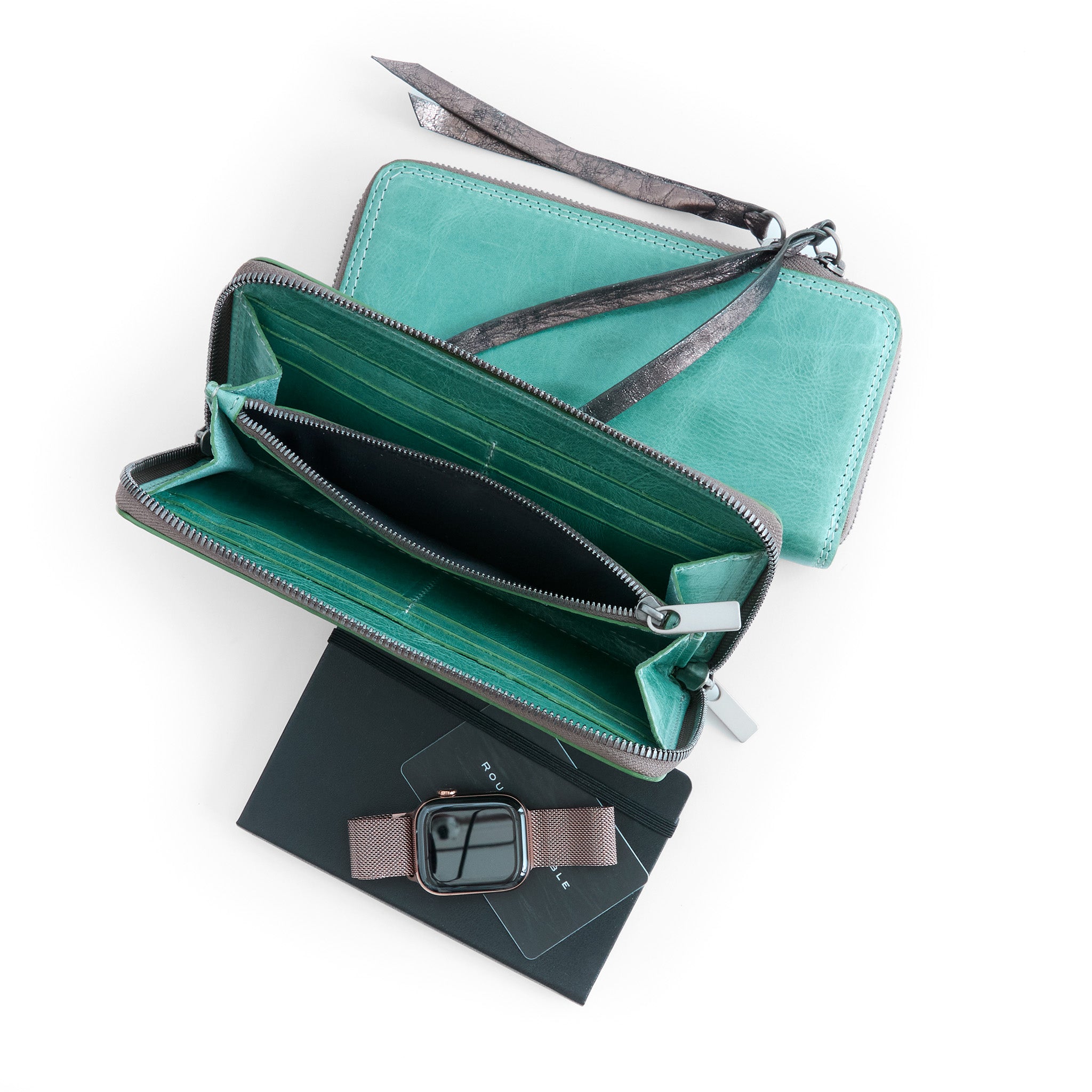 two wallets in tiffany, one with metal pulls and one with mica bronze leather pulls, showcasing interior compartments