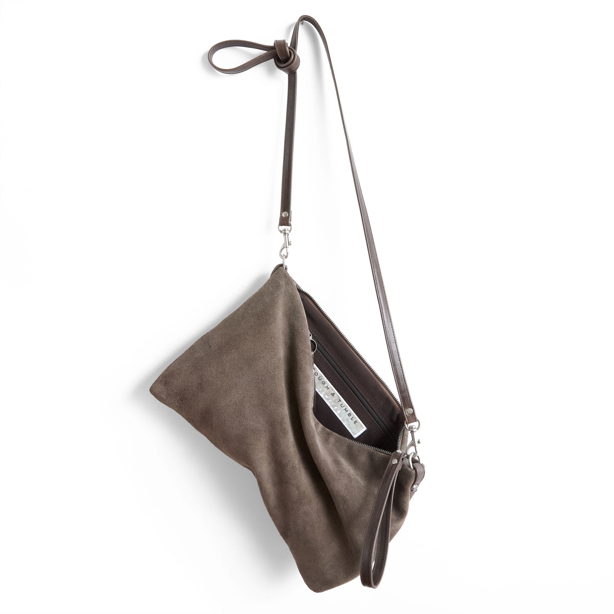 the covet in buff suede, showcasing interior cocoa lining and zippered pocket