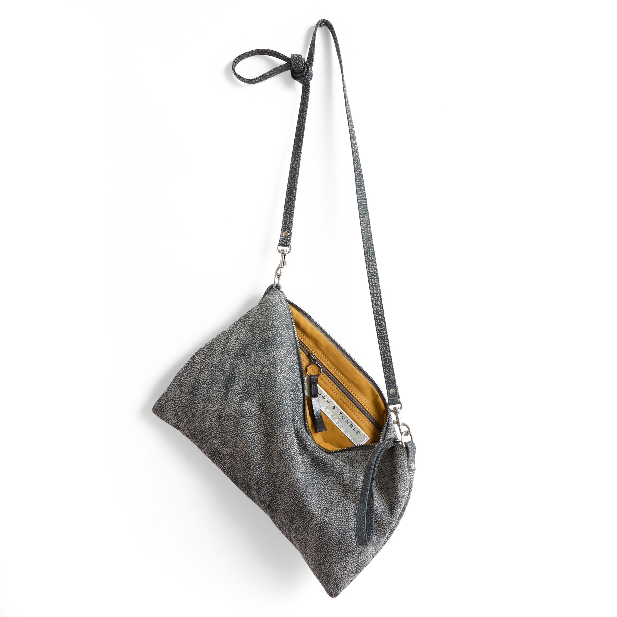 the covet in elephant ear, showcasing interior bumble lining and zippered pocket