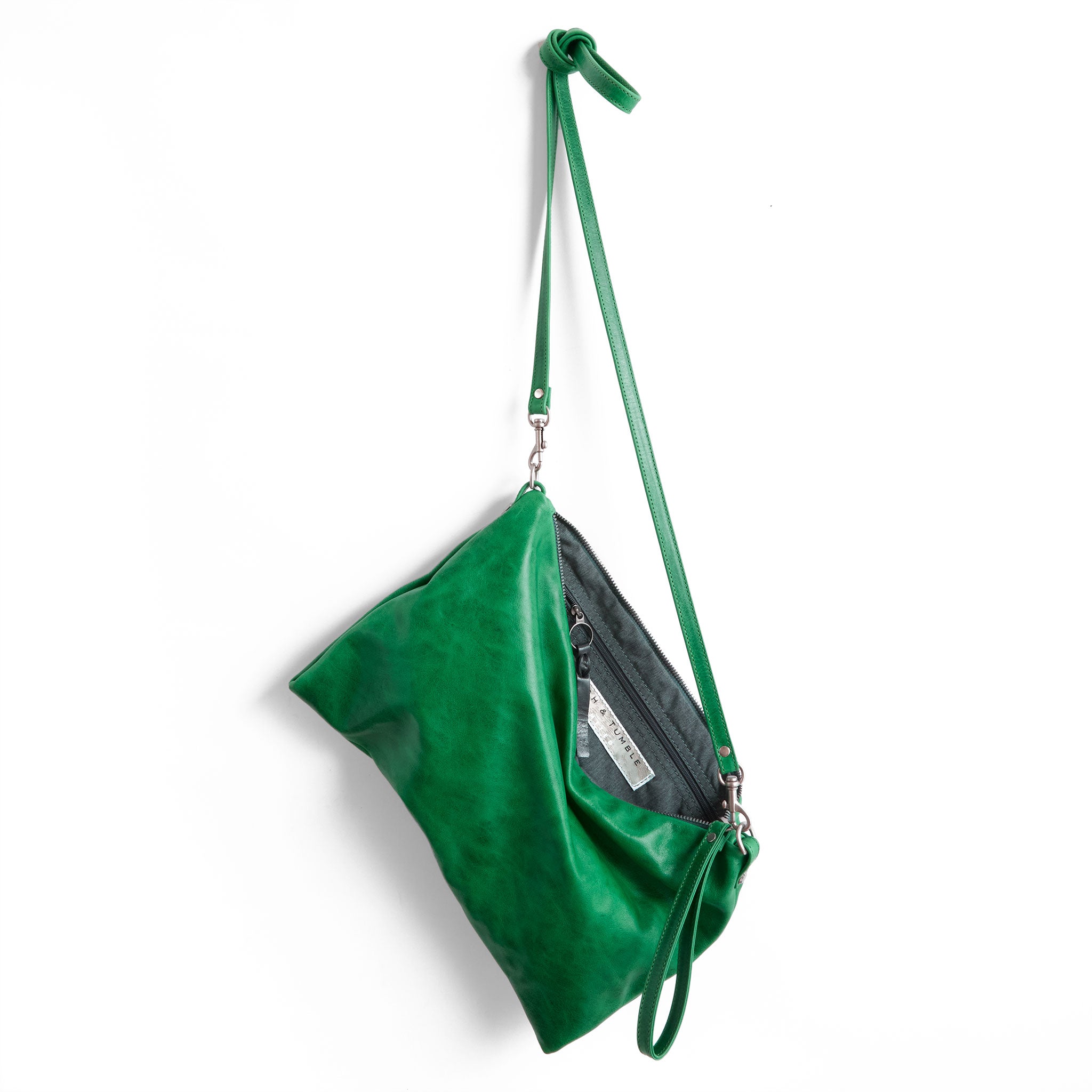 the covet in emerald, showcasing interior grey chambray lining and zippered pocket